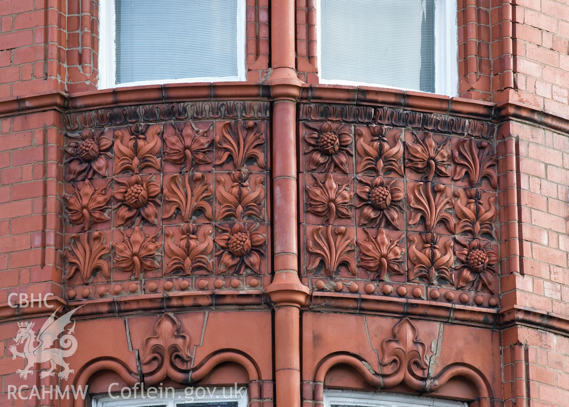 Detail of terracota panel between windows.