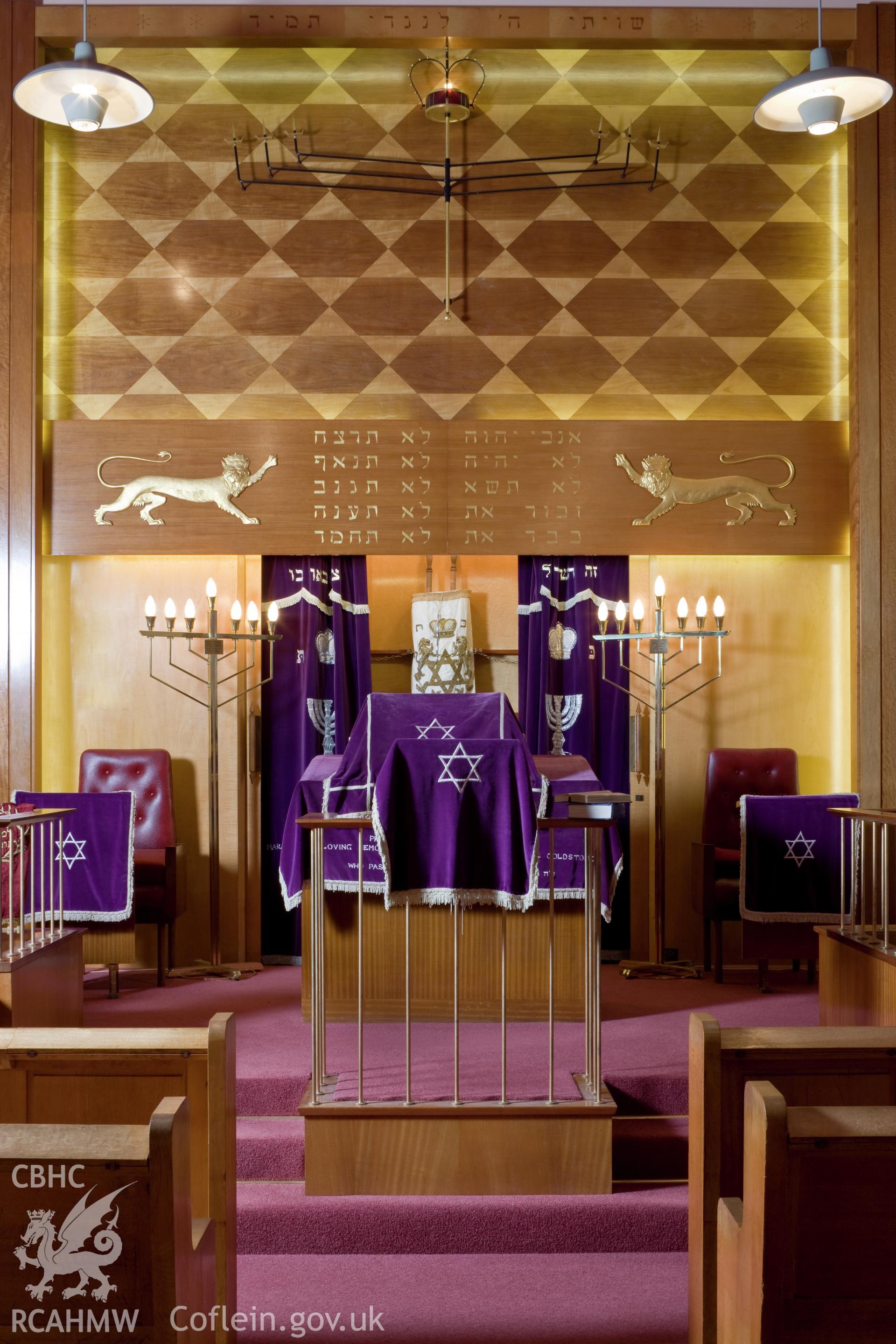 Reading platform (bimah), and open ark, with Torah scroll.