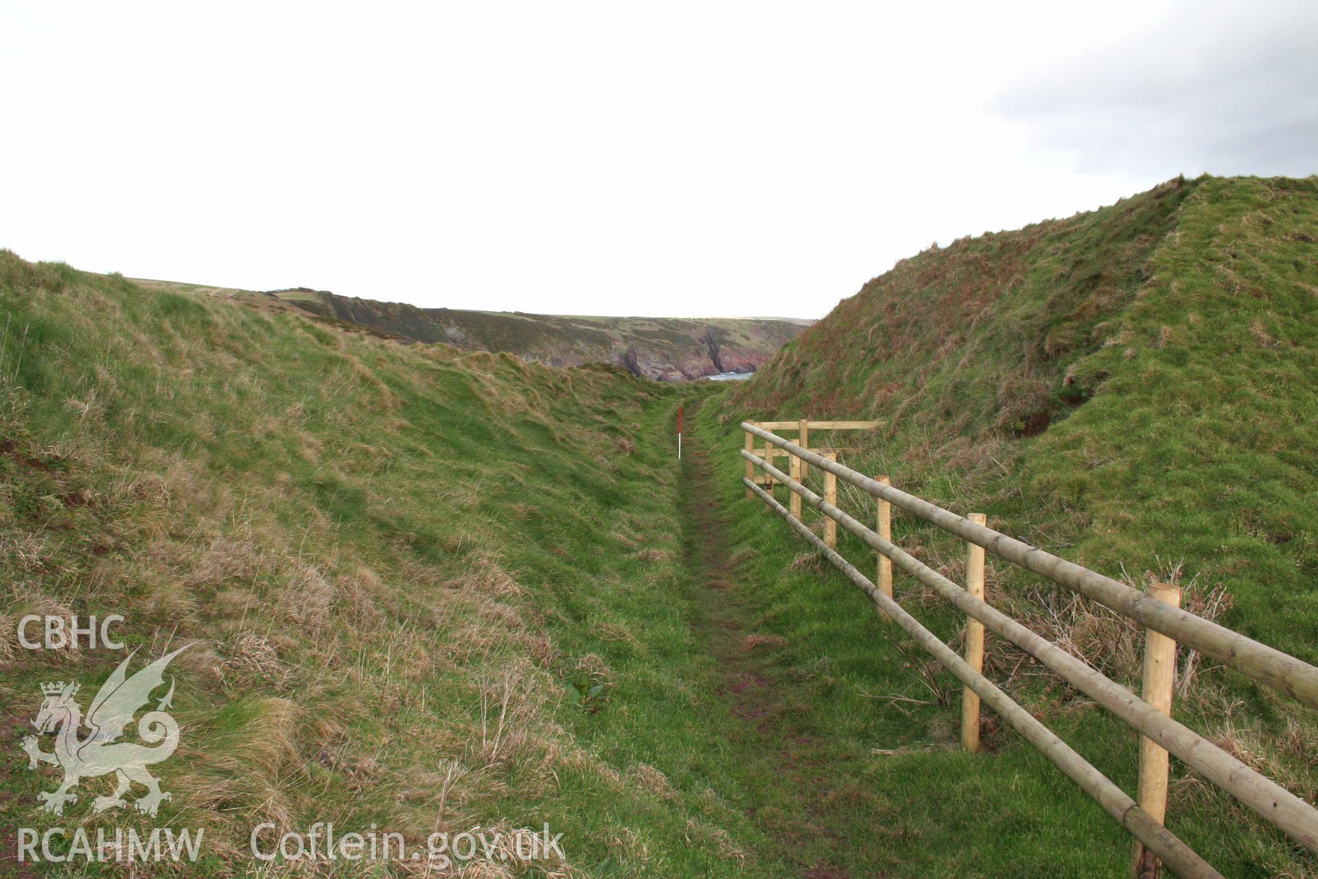 Looking north-east along the ditch between the inner and middle rampart banks of the annexe defences.