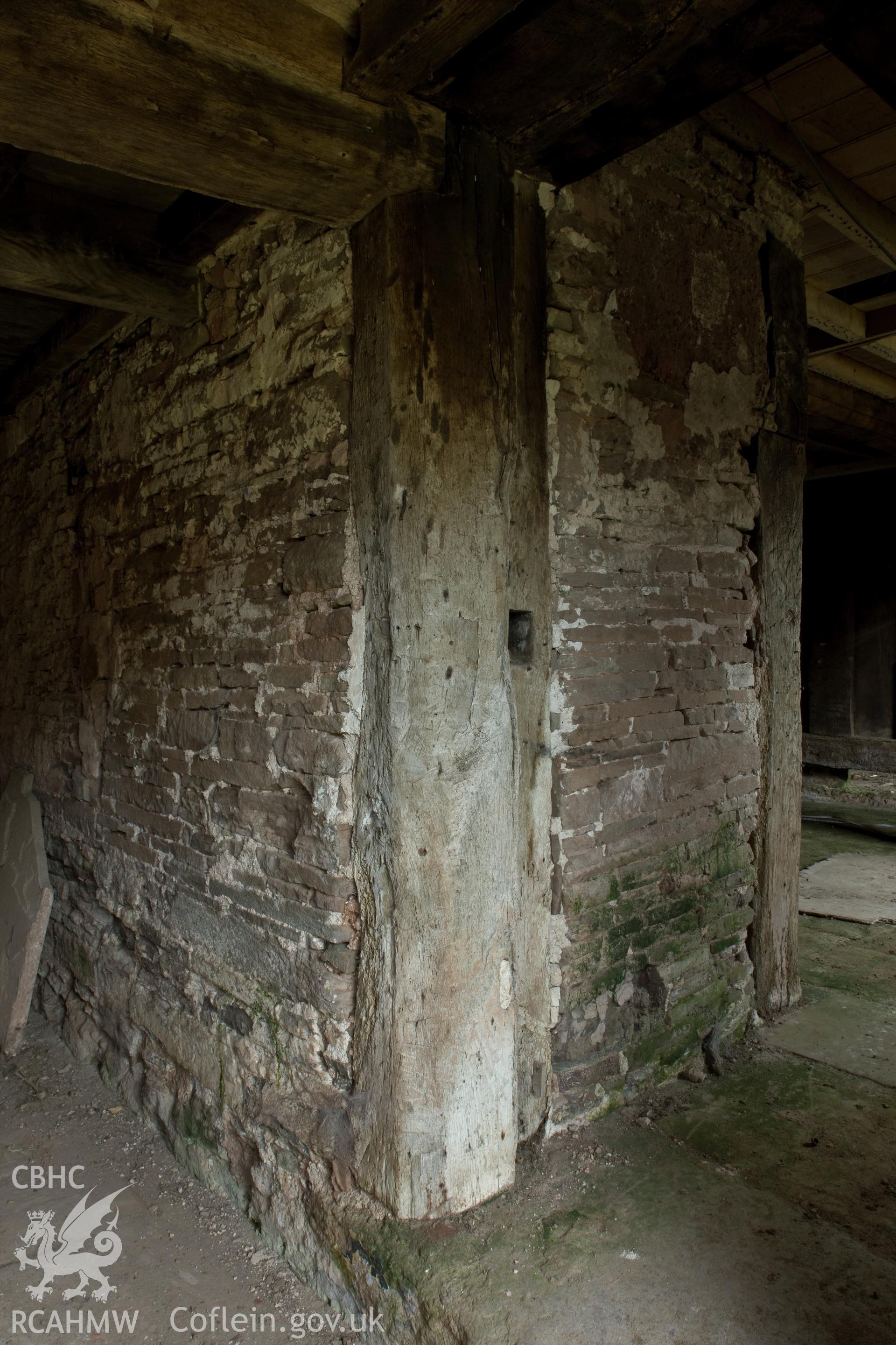 Massive doorpost with draw bar slot into main chamber.