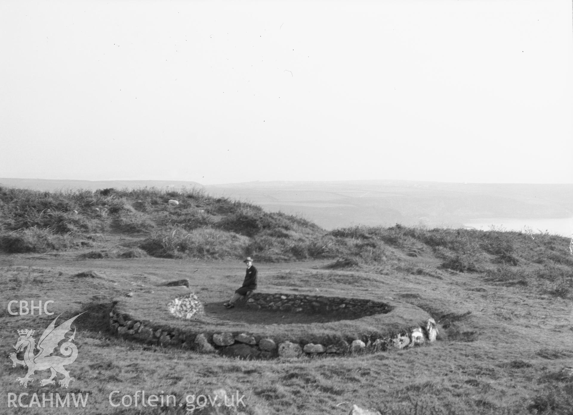 Hut with figure.