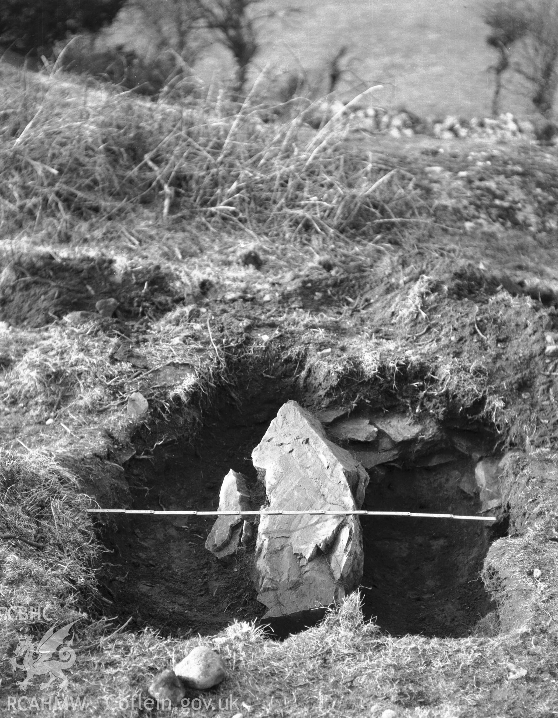 One black and white photograph showing the excavated hole at Din Dryfol, taken by RCAHMW 1929.