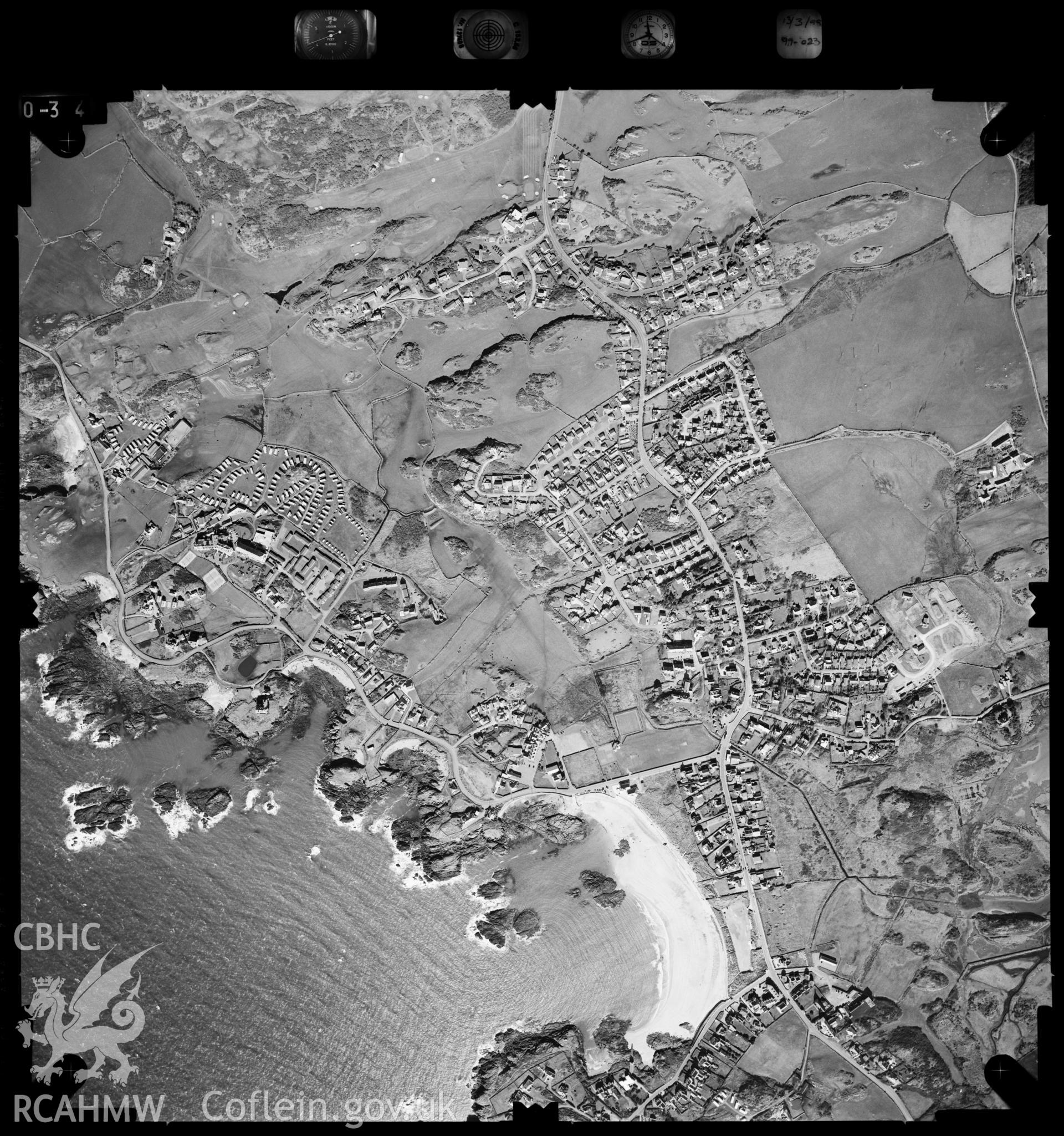 Digitized copy of an aerial photograph showing Trearddur Bay, taken by Ordnance Survey, 1999.