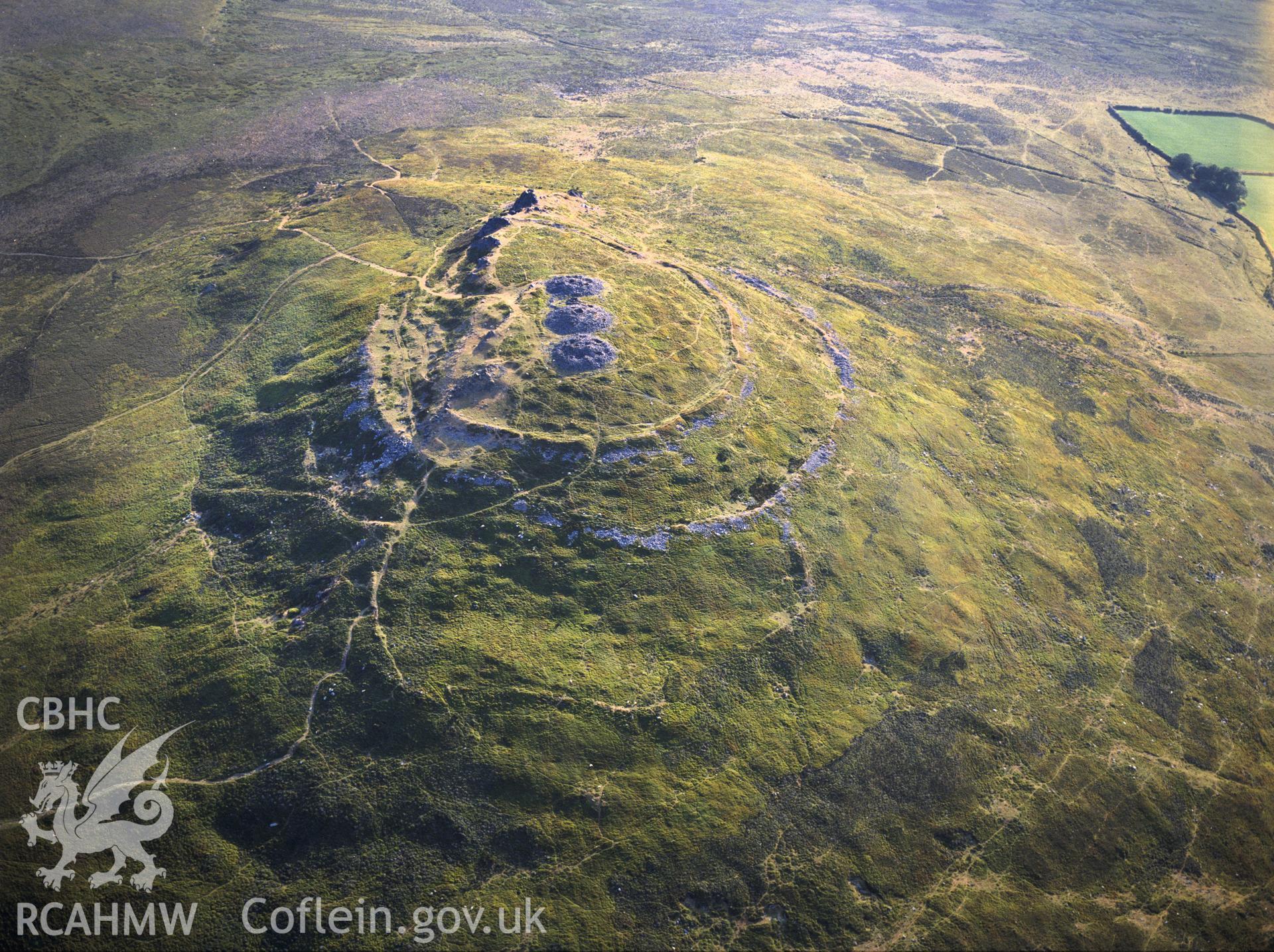 RCAHMW colour oblique aerial photograph of Foel Drygarn Camp, taken by C R Musson, 1989.