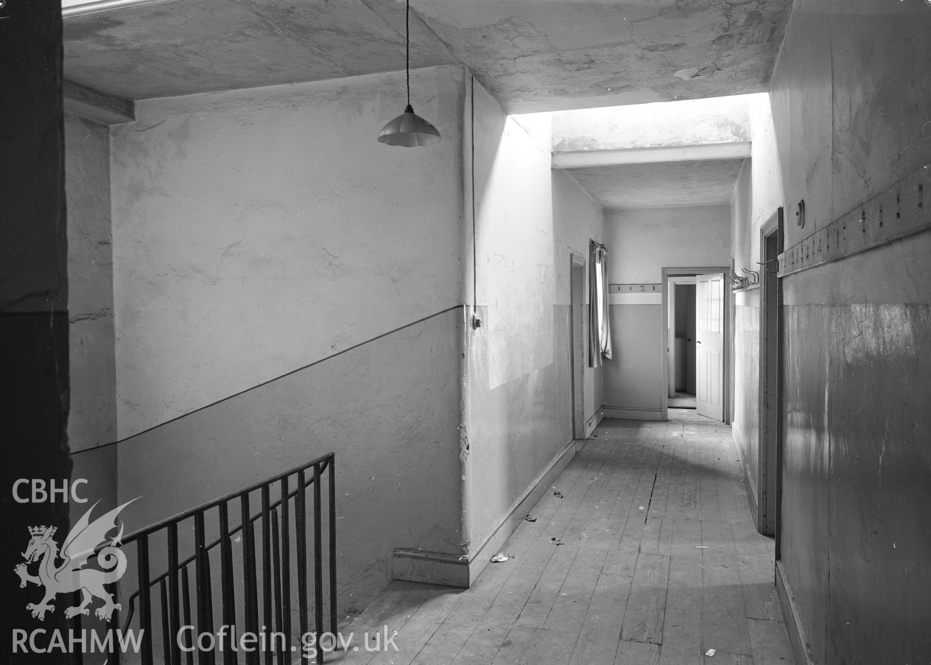 D.O.E photograph of Flint Gaol - first floor corridor looking south east. In castle outer ward (since removed).