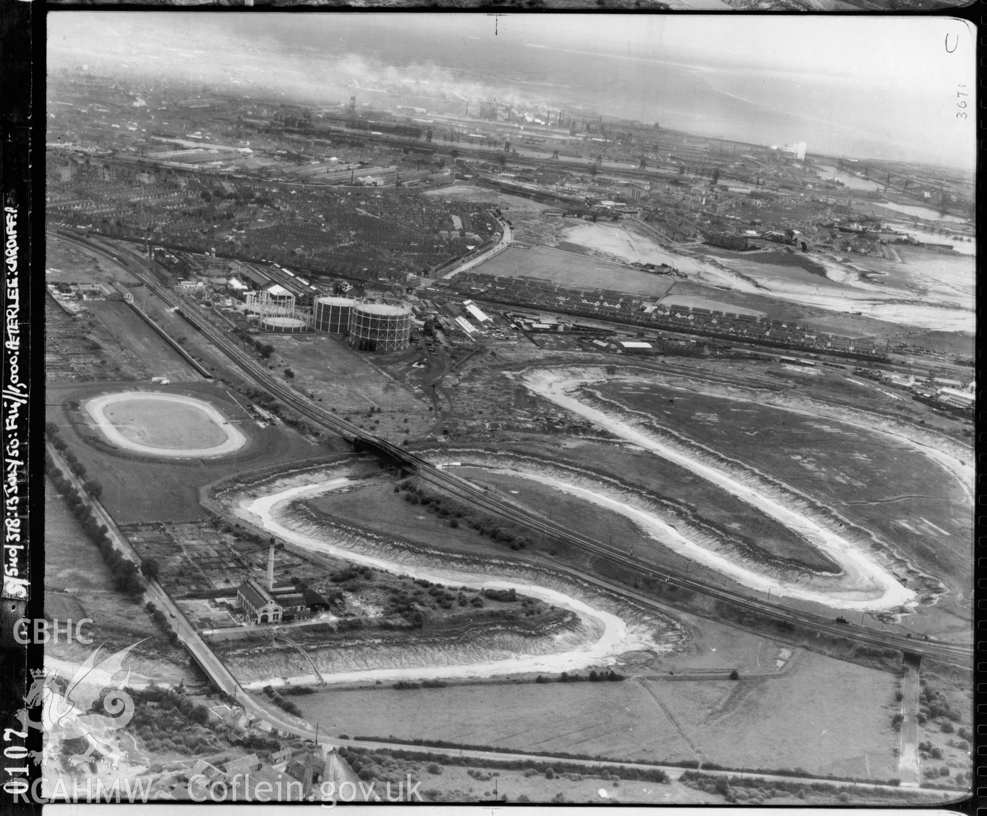 Black and white low level oblique aerial photograph taken by the RAF 1950 centred on Penarth Road Stadium, Cardiff.