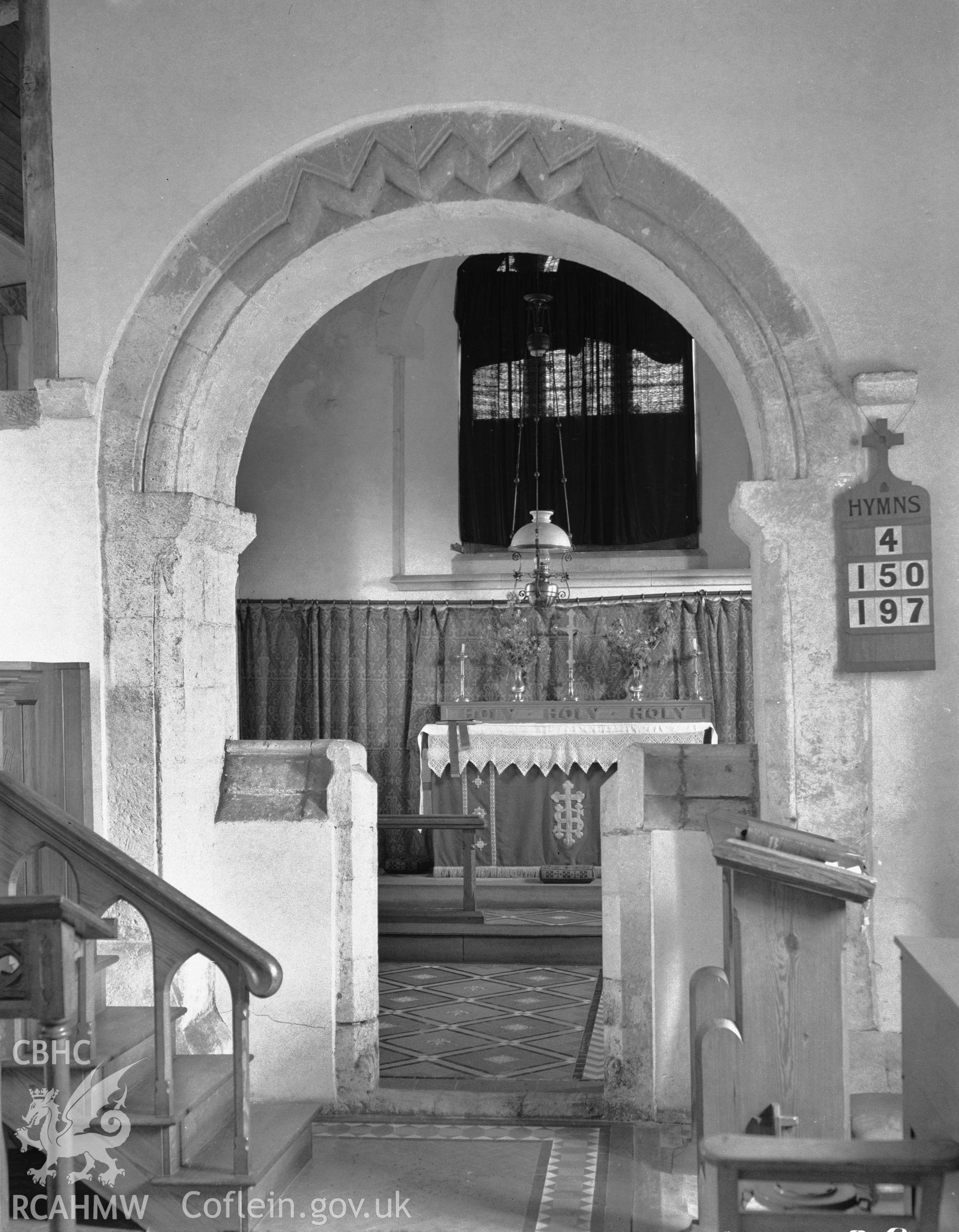 Interior view showing the west side of the chancel arch and the screen.