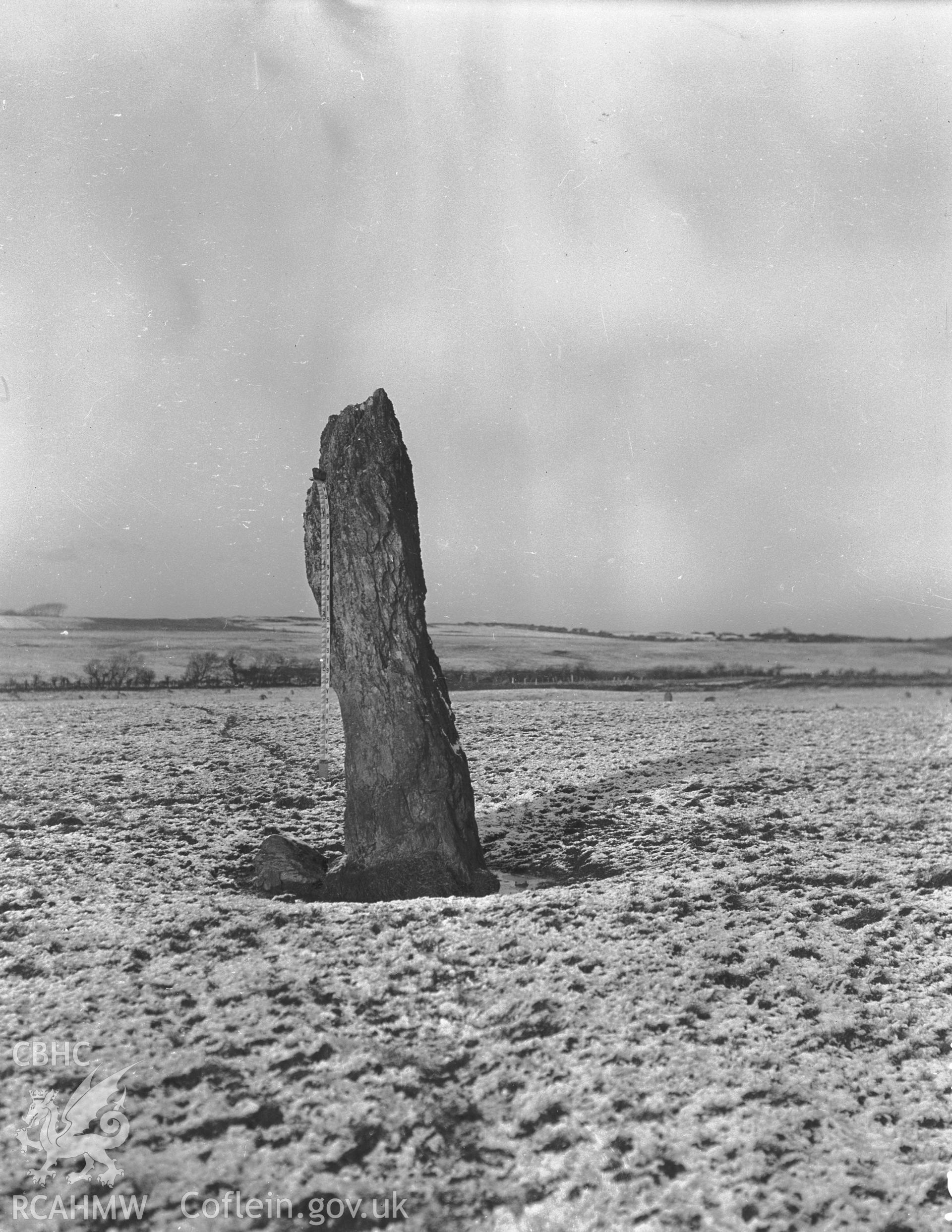 Black and white photograph showing Cremlyn North Standing Stone, taken by RCAHMW before 1960.