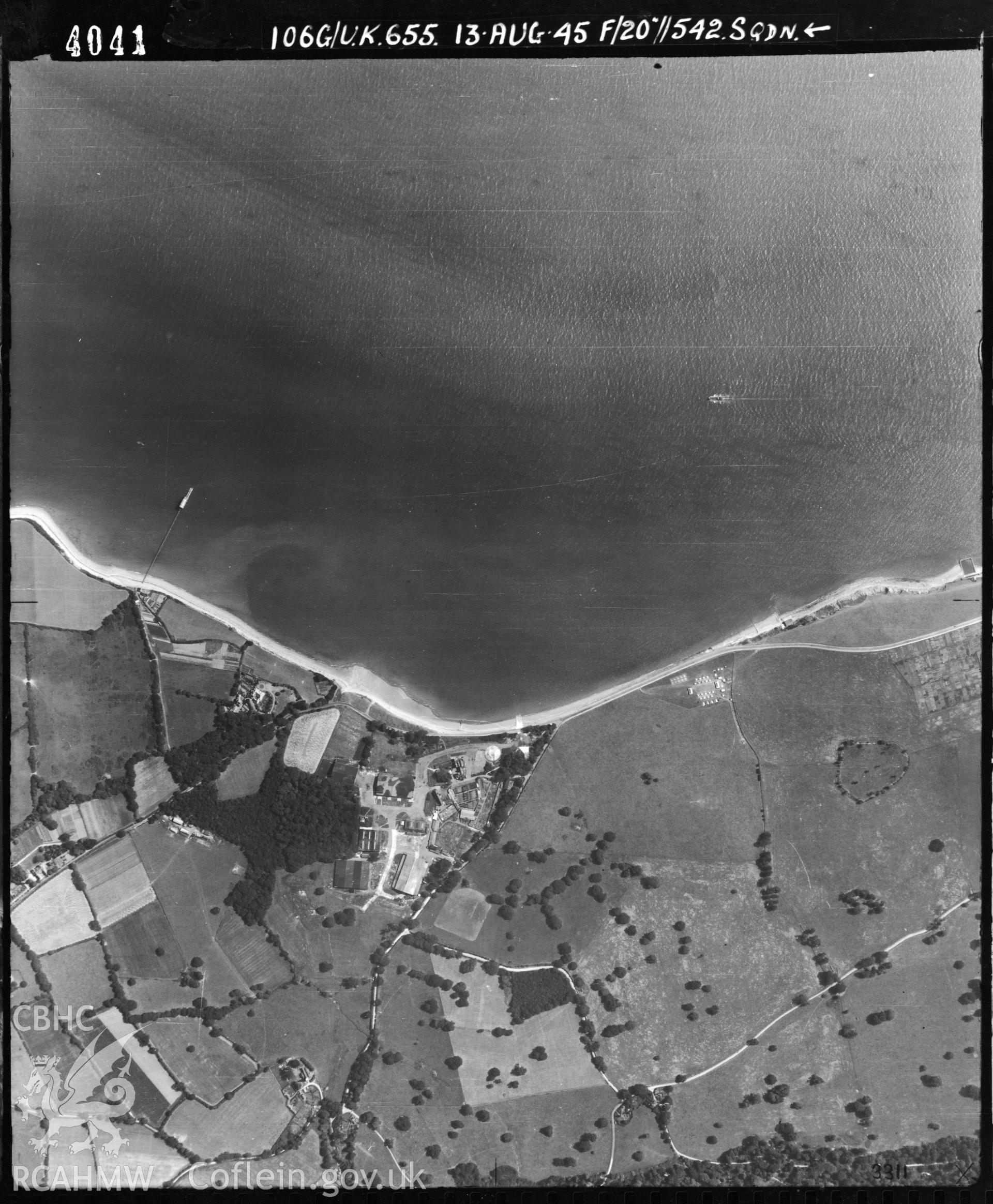 Black and white vertical aerial photograph taken by the RAF on 13/08/1945 centred on SH61177730 at a scale of 1:10000. The photograph includes part of Beaumaris community on the Isle of Anglesey.