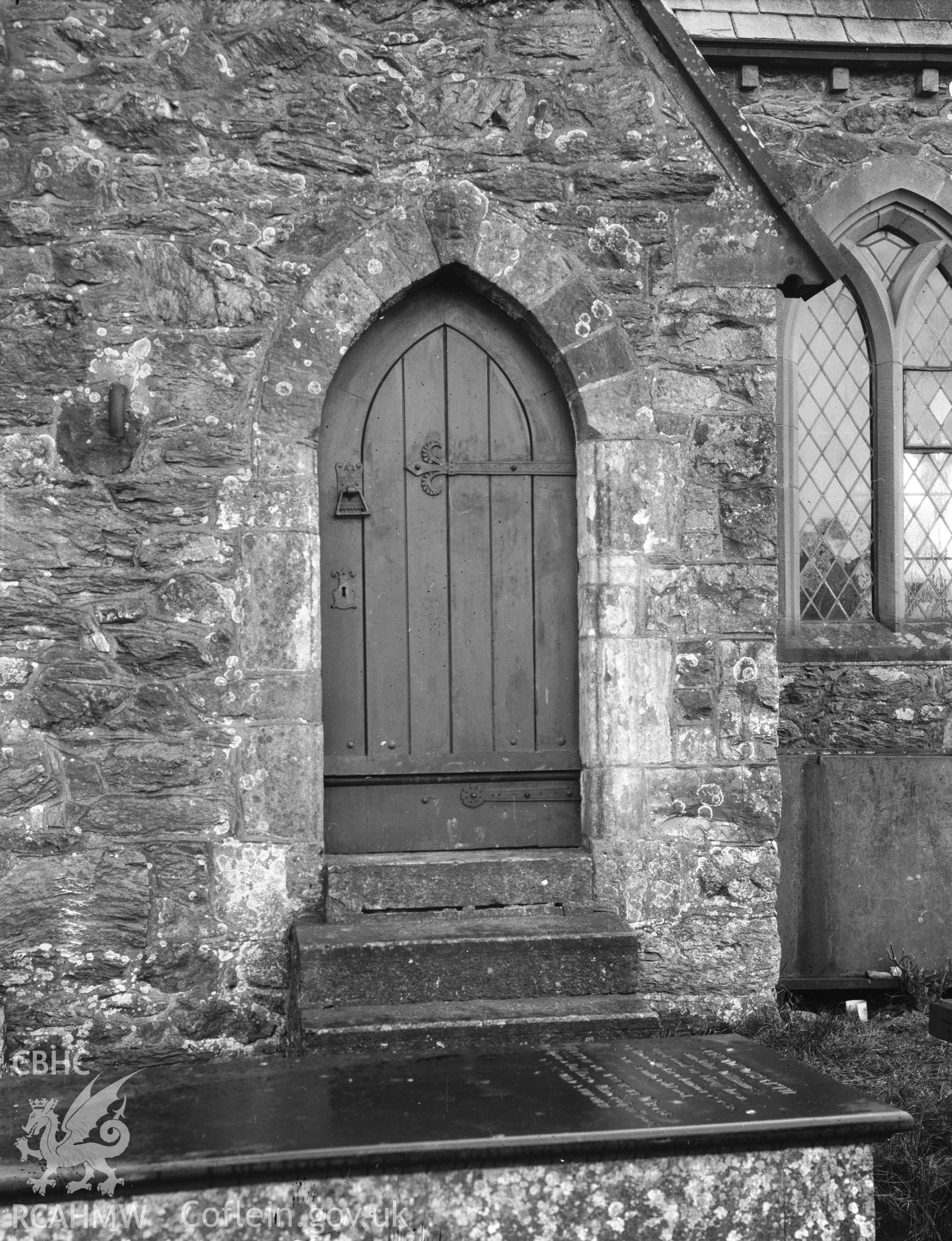 Digitised copy of a black and white negative showing door at St Deiniolen's Church, produced by RCAHMW, before 1960.