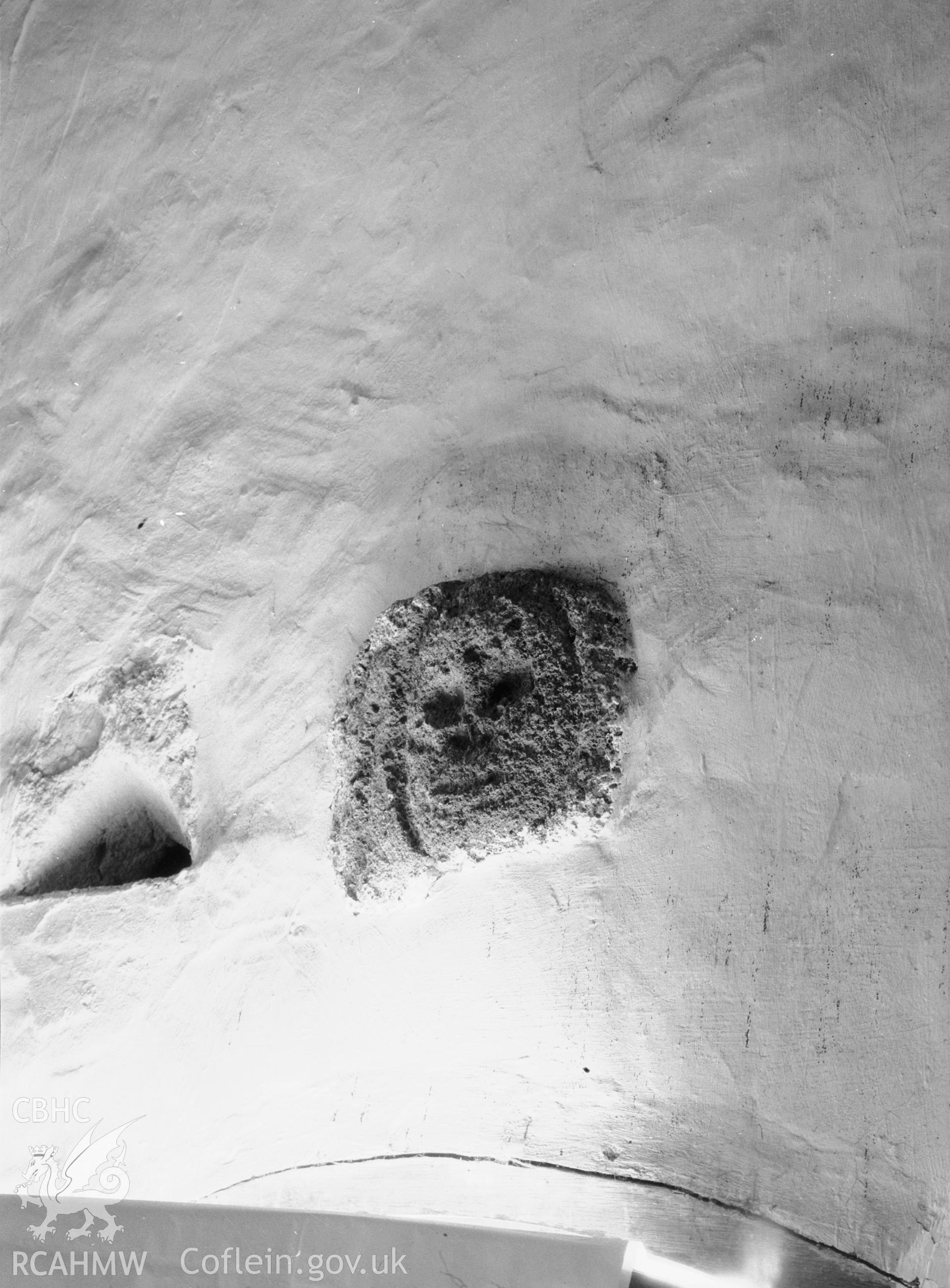 Carved head above South door inside