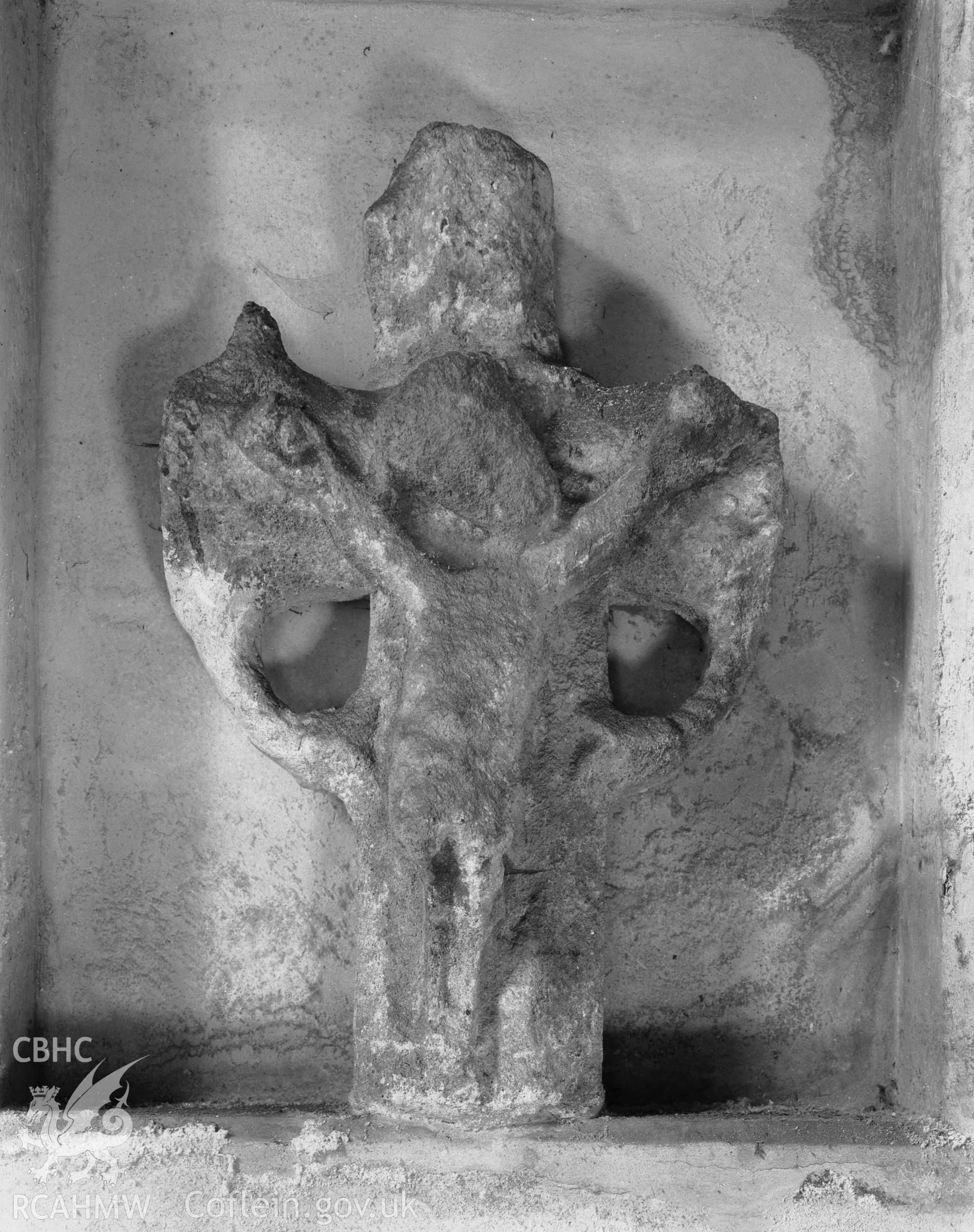 Crucifix set in north wall of nave