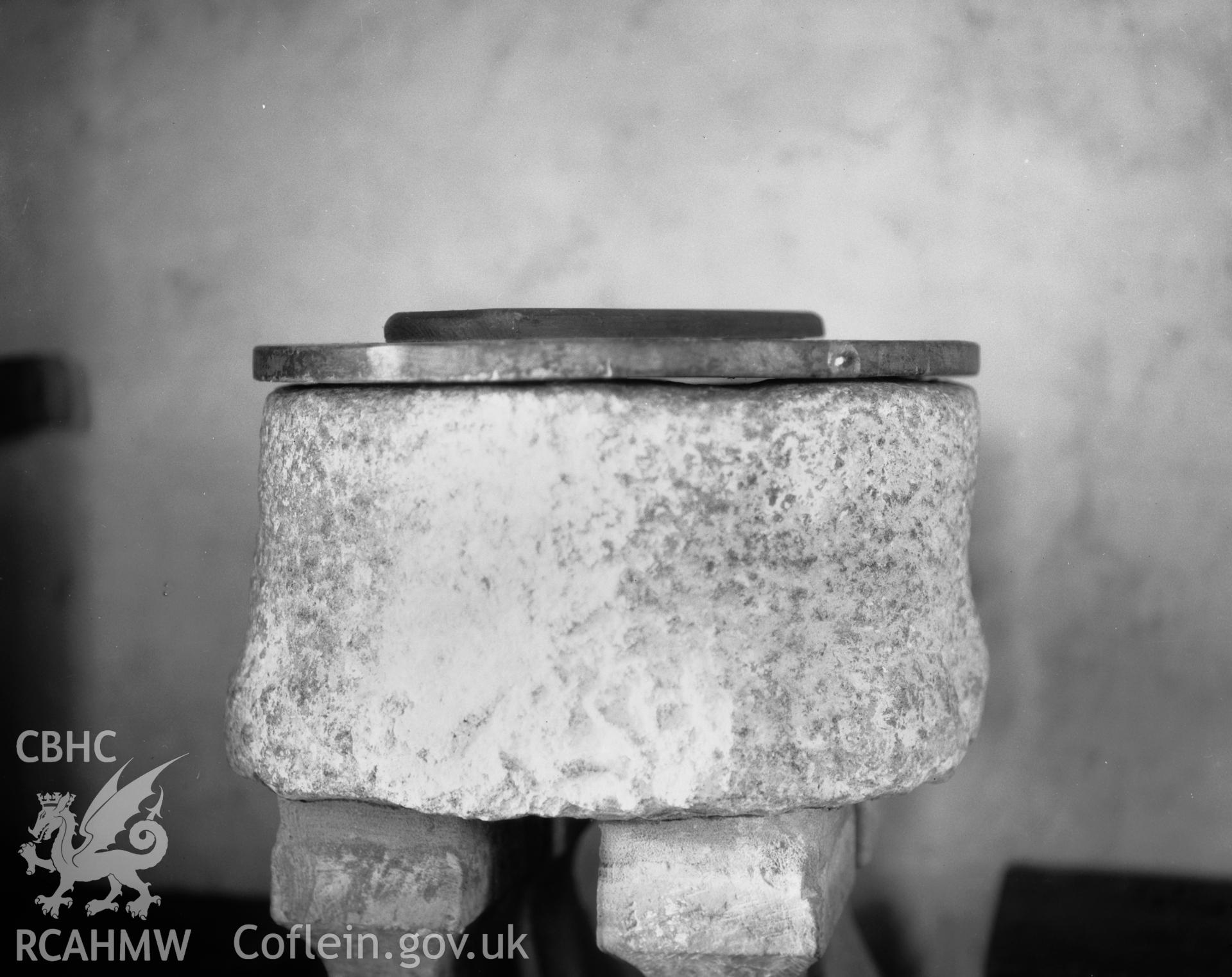 Black and white photograph of the font at St Peirio's Church, Bodewryd.