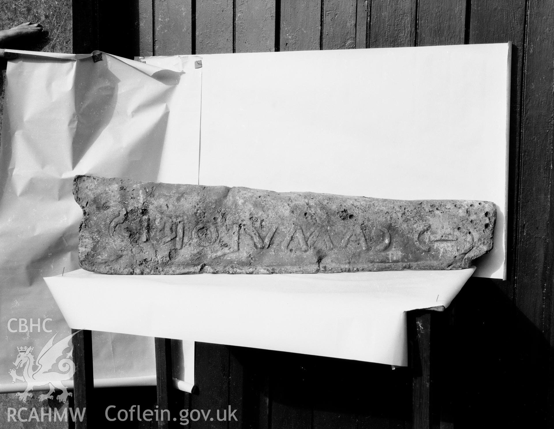 Digitised copy of a black and white negative showing part of lead coffin found at Rhuddgaer, produced by RCAHMW before 1960