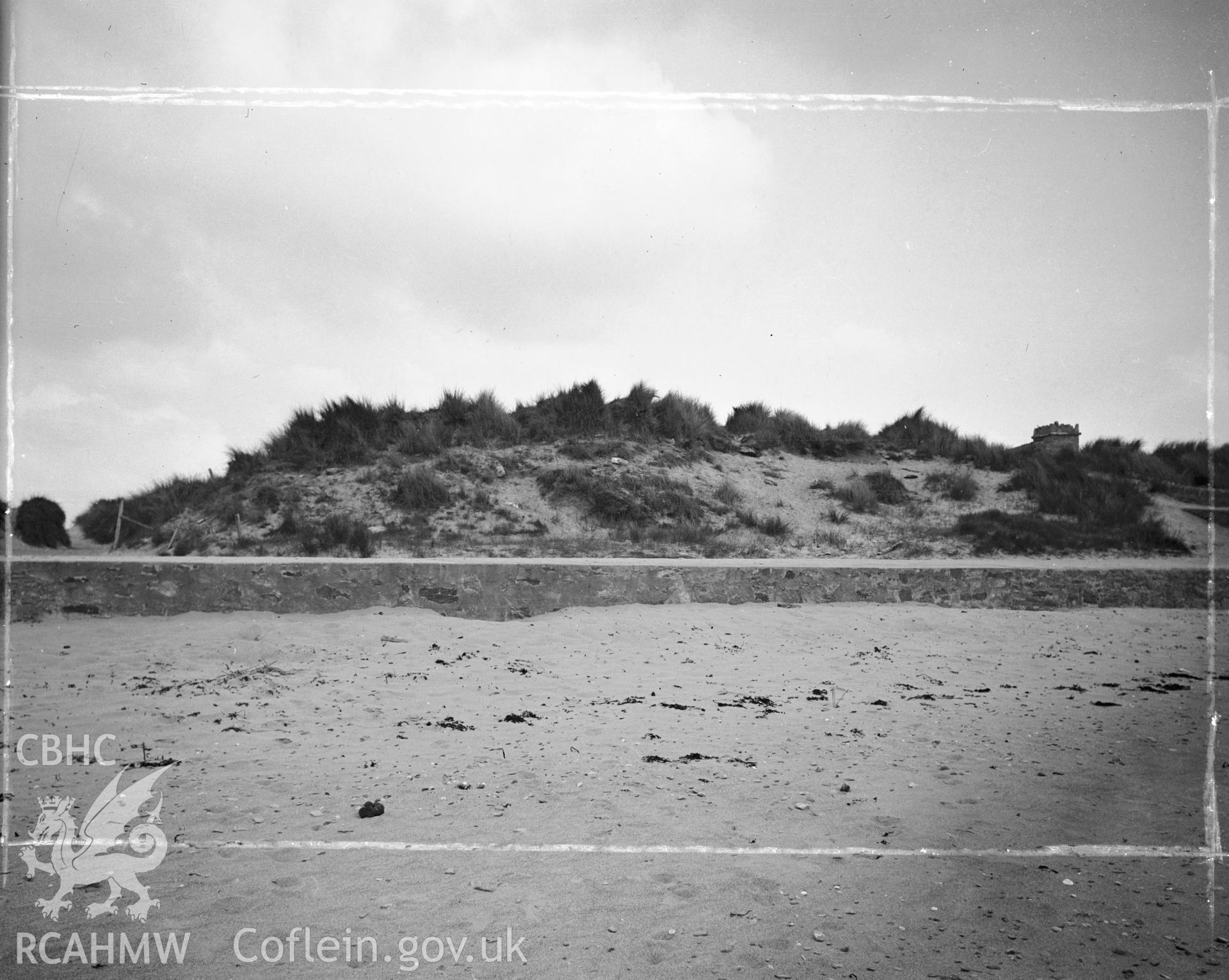 Digitised copy of a black and white negative showing Towyn y Capel Mound, produced by RCAHMW before 1960