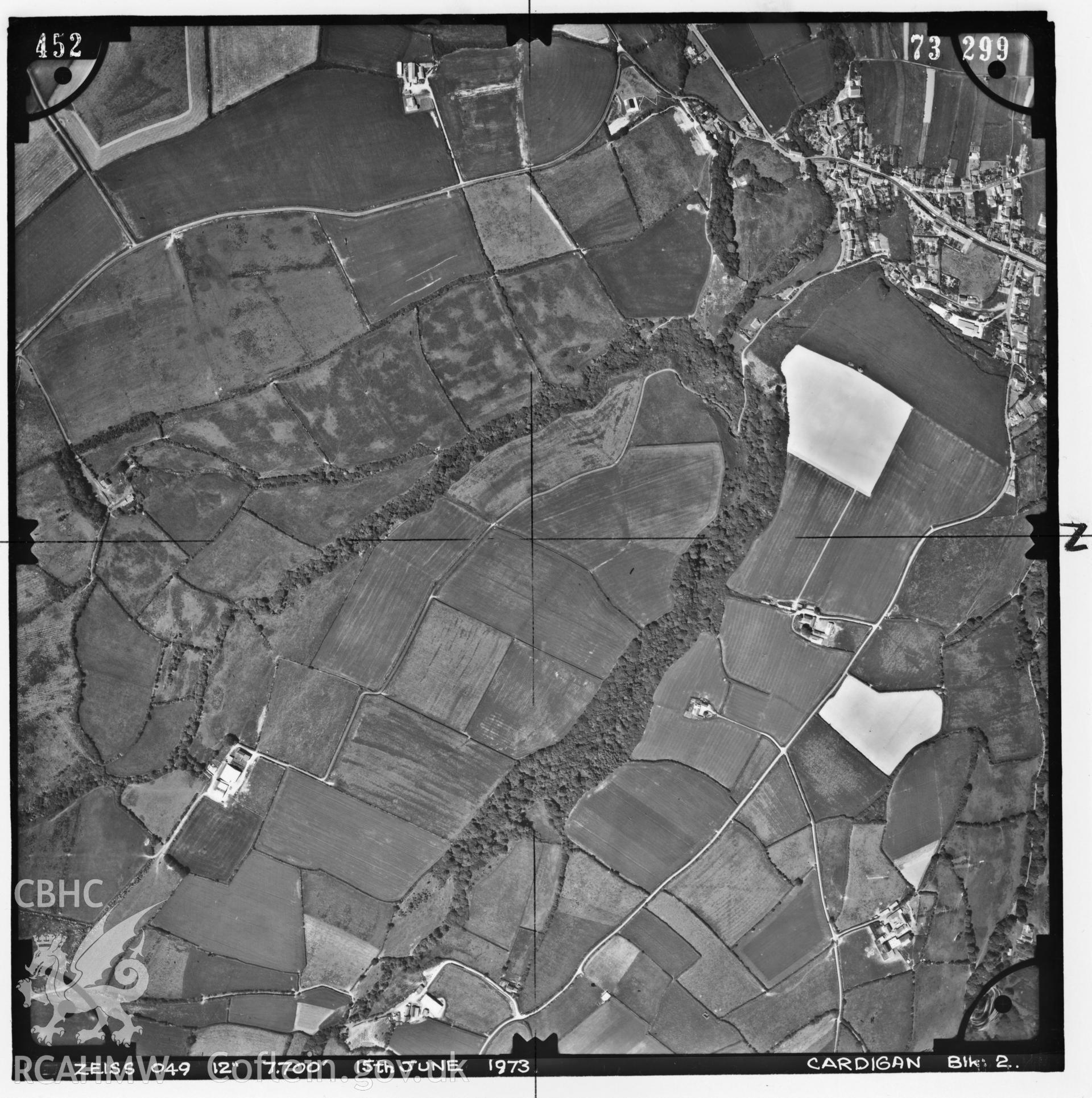 Digitized copy of an aerial photograph showing the area around Llanon, Ceredigion, taken by Ordnance Survey, 1975.