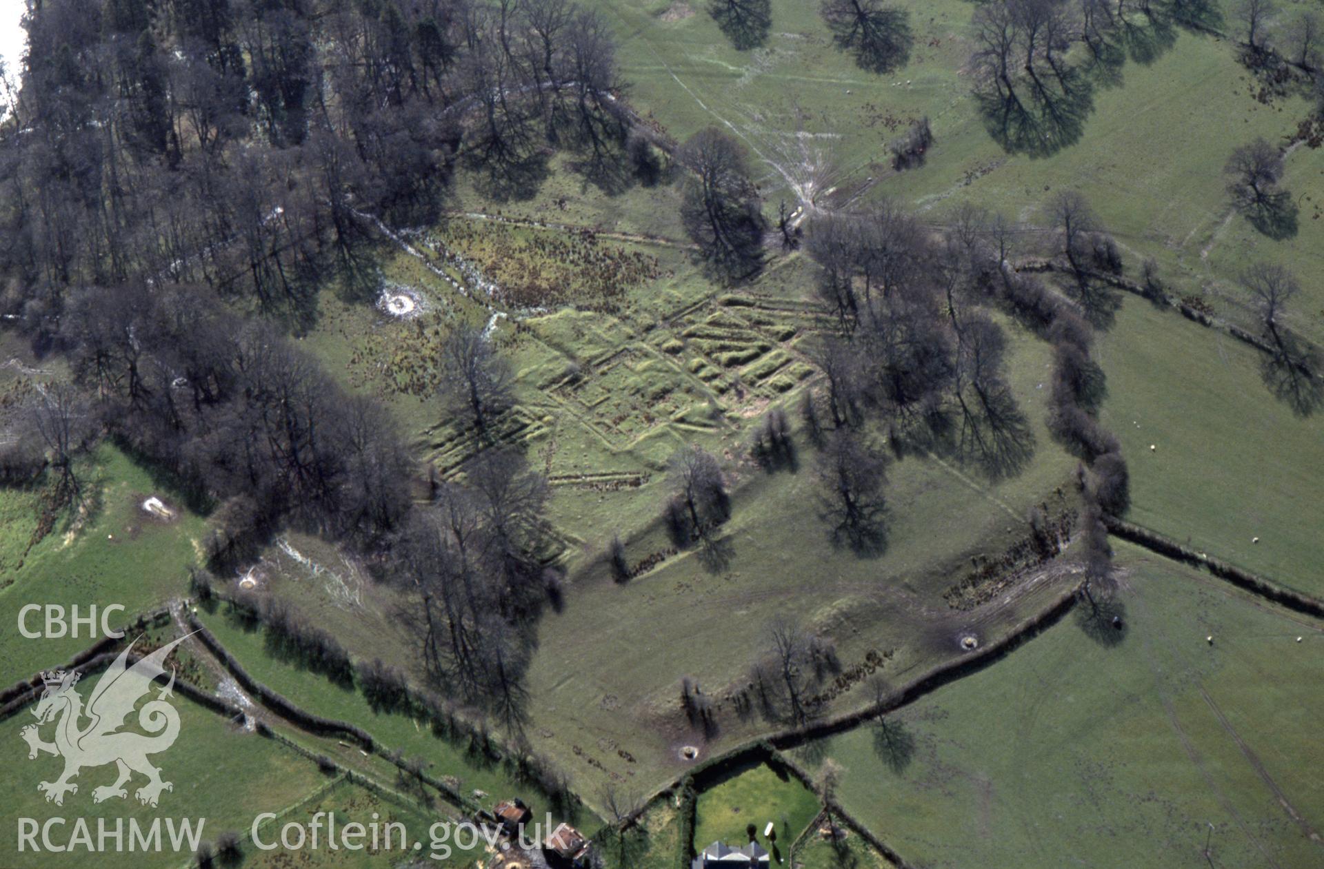 RCAHMW colour slide oblique aerial photograph of Castell Collen Roman Fort, Llanyre, taken by C.R. Musson, 26/03/94