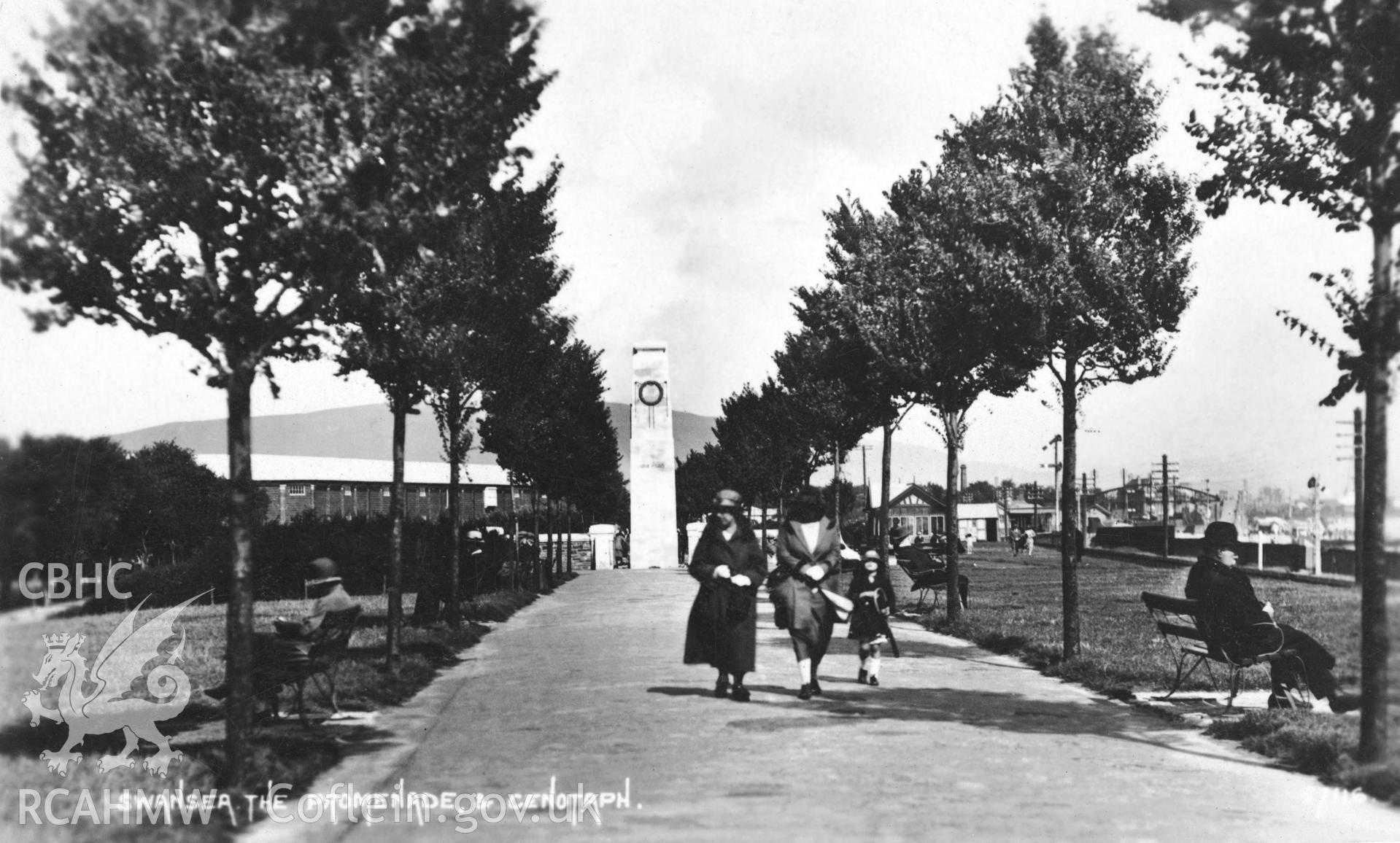 Digitised copy of an undated  black and white postcard showing The Cenotaph and Promenade, Swansea, produced by The Photochrom Company Ltd, loaned for copying by Daryl Leeworthy.