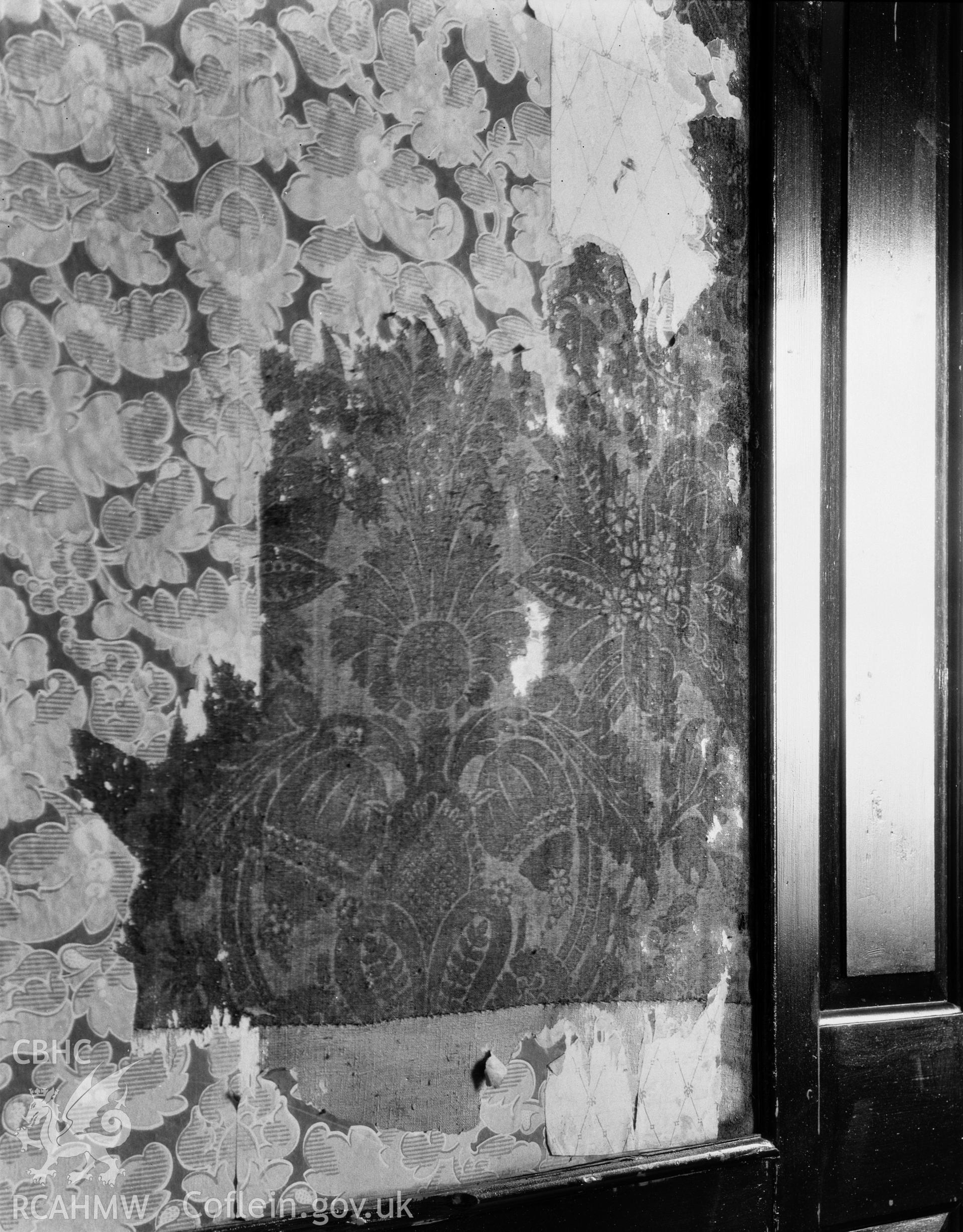 Digitised copy of a black and white negative showing wall decoration at Caerau, Llangynhornwy produced by RCAHMW, pre1960.