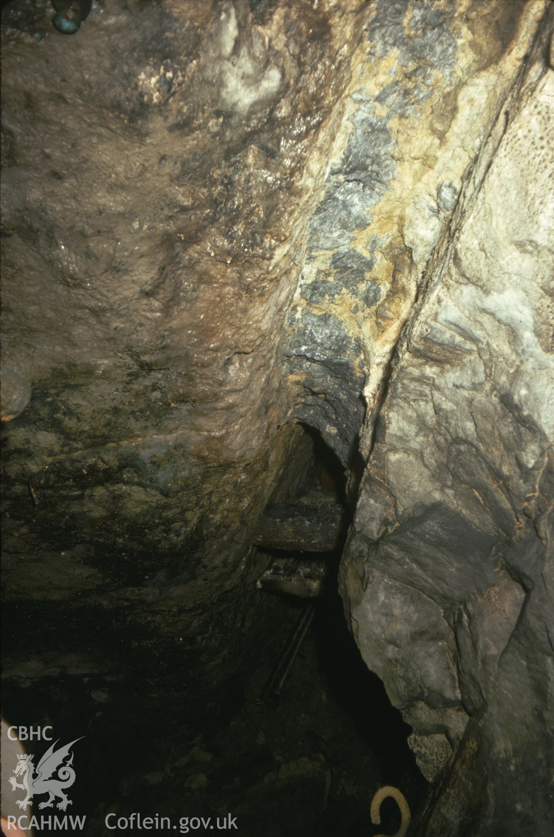 Digitized 35mm slide of Milwr Tunnel, Halkyn, showing men working a vein in Lode 621.