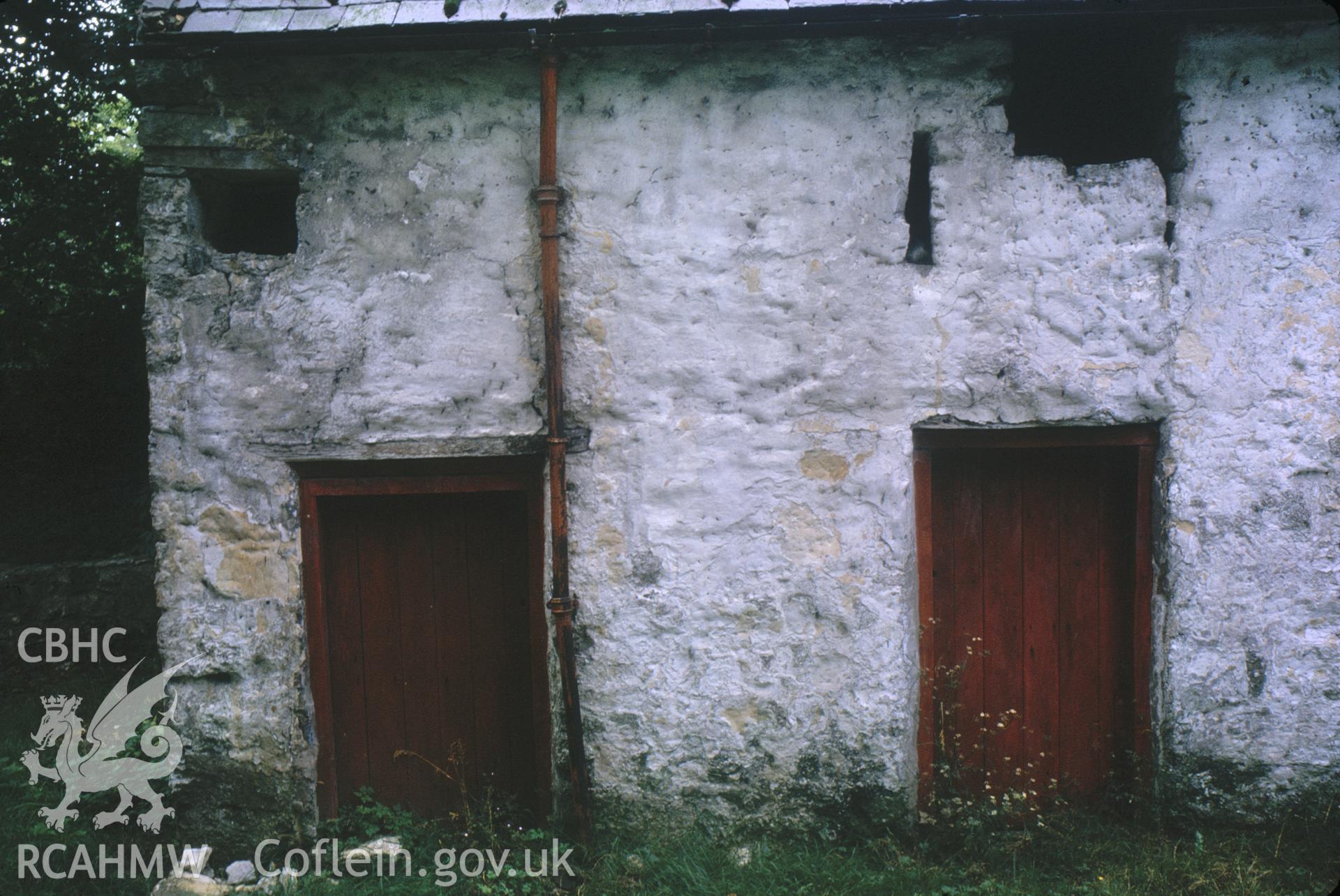 Digitized 35mm slide of barn at Maeshafn showing a hole for the flat rod of waterwheel.