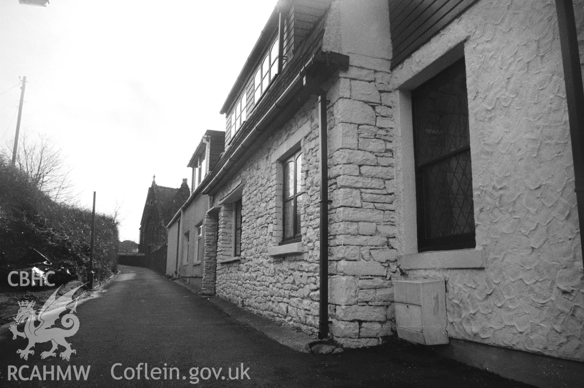 Photograph of All Saints Church, Kilvey Road, Swansea: showing the east wall of the former Kilvey Infants School, looking south to the church.