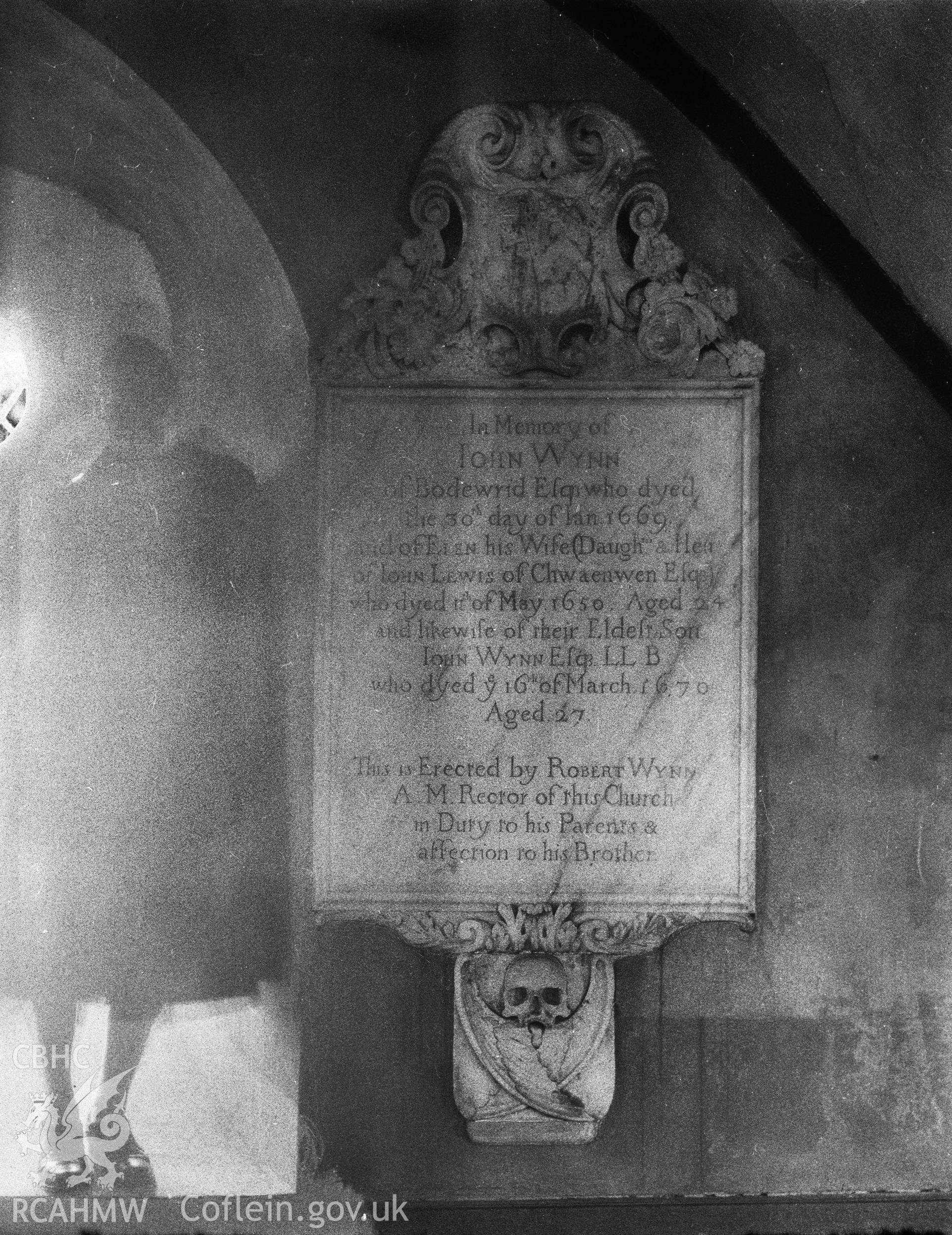 Digitised copy of a black and white negative showing memorial in Llanrisant Old Church, produced by RCAHMW before 1960
