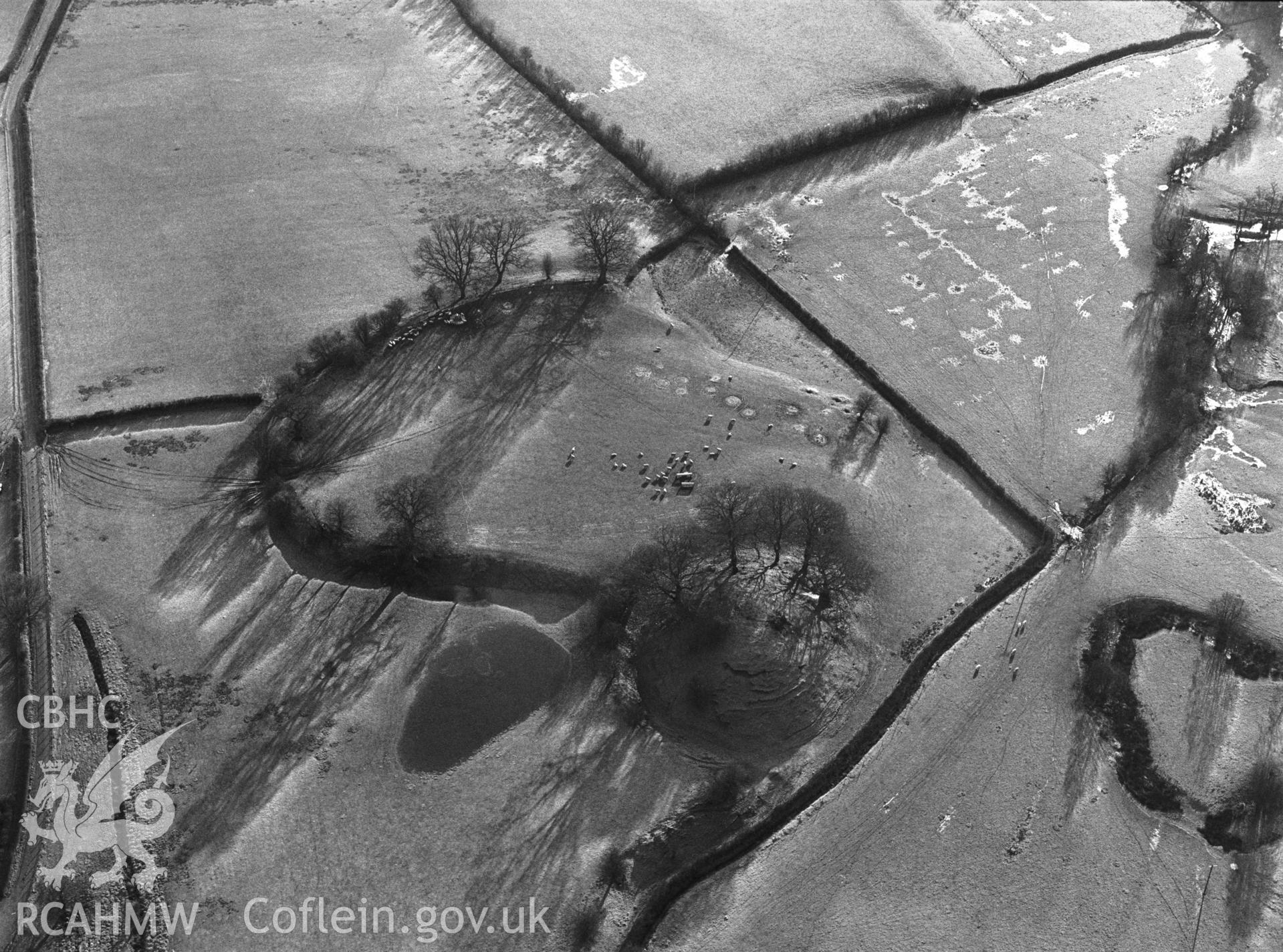 RCAHMW Black and white oblique aerial photograph of The Mount Motte and Bailey, Glascwm, taken on 09/01/1999 by CR Musson