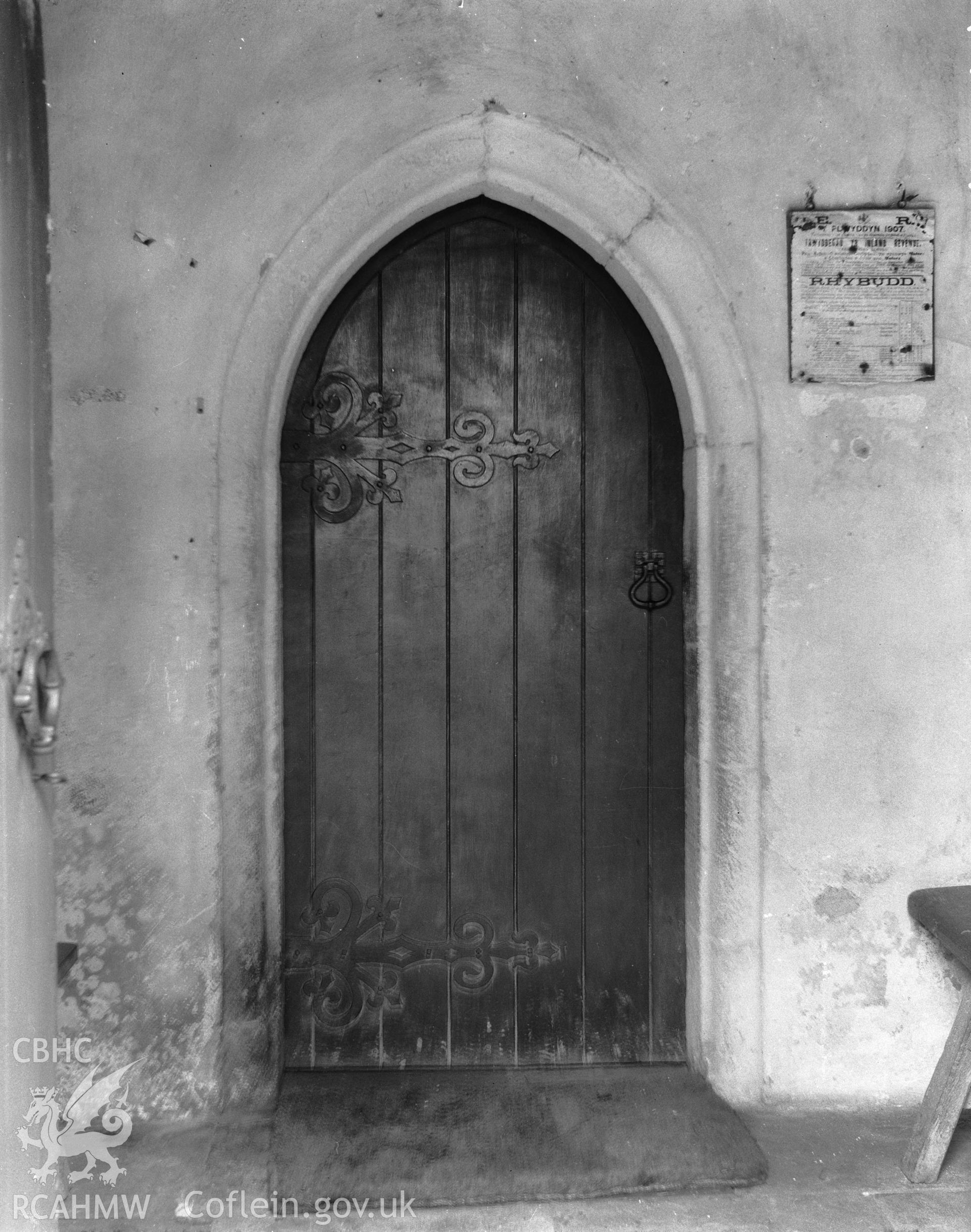 Digitised copy of a black and white negative showing door at St Tyfrydog's Church, produced by RCAHMW, before 1960.