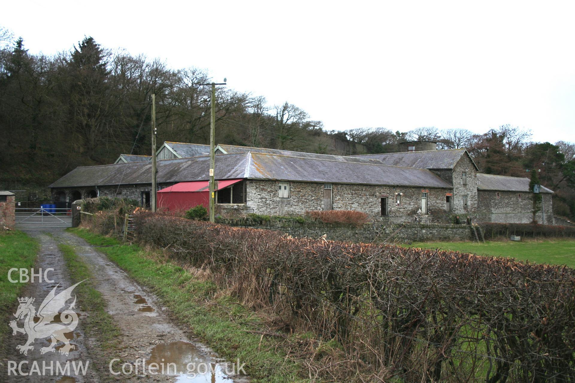 View from south-east, showing cart-house/stable range to left and storied gable of the barn range.