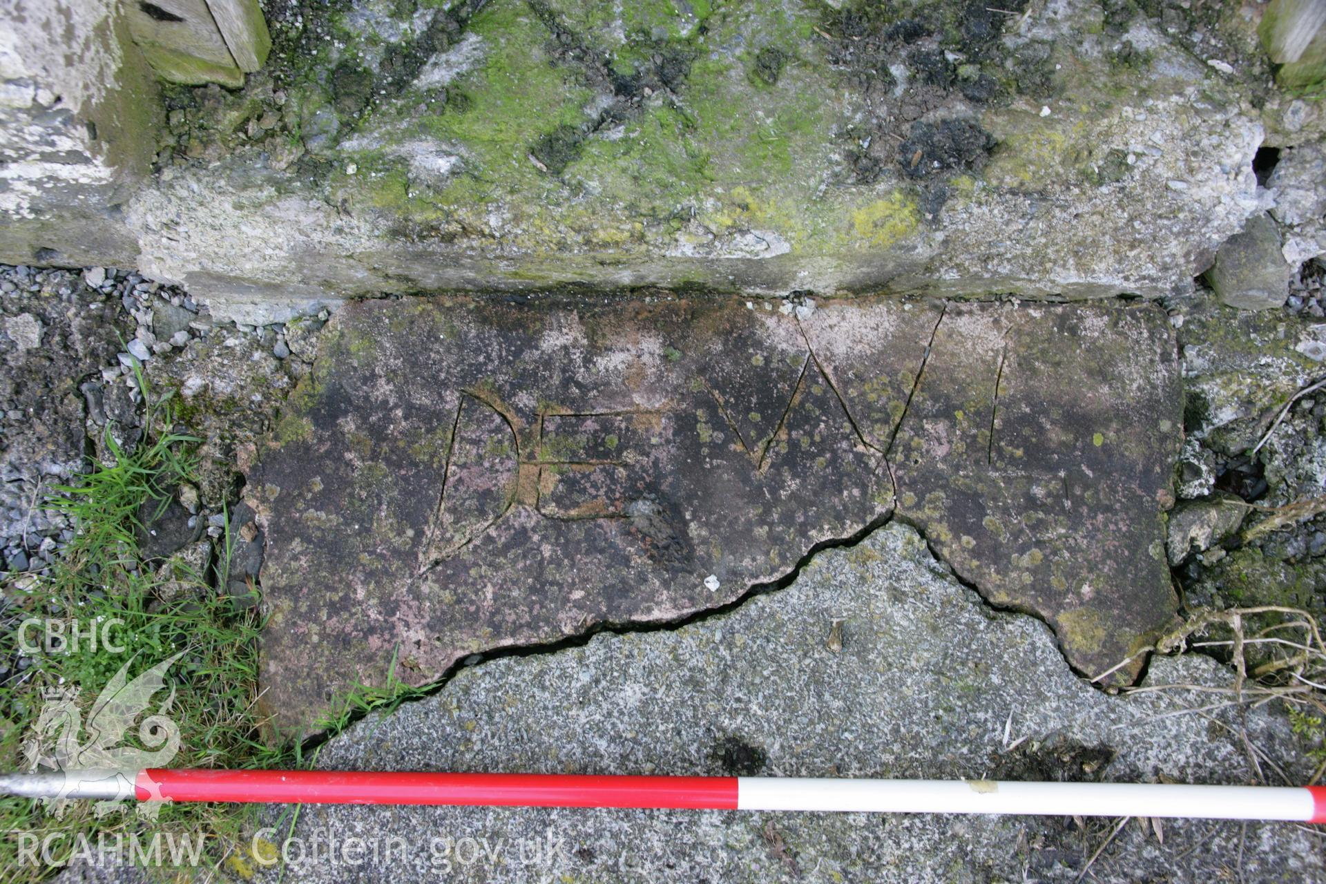 Spite Inn: modern graffiti in concrete on step outside barn, on north side of yard