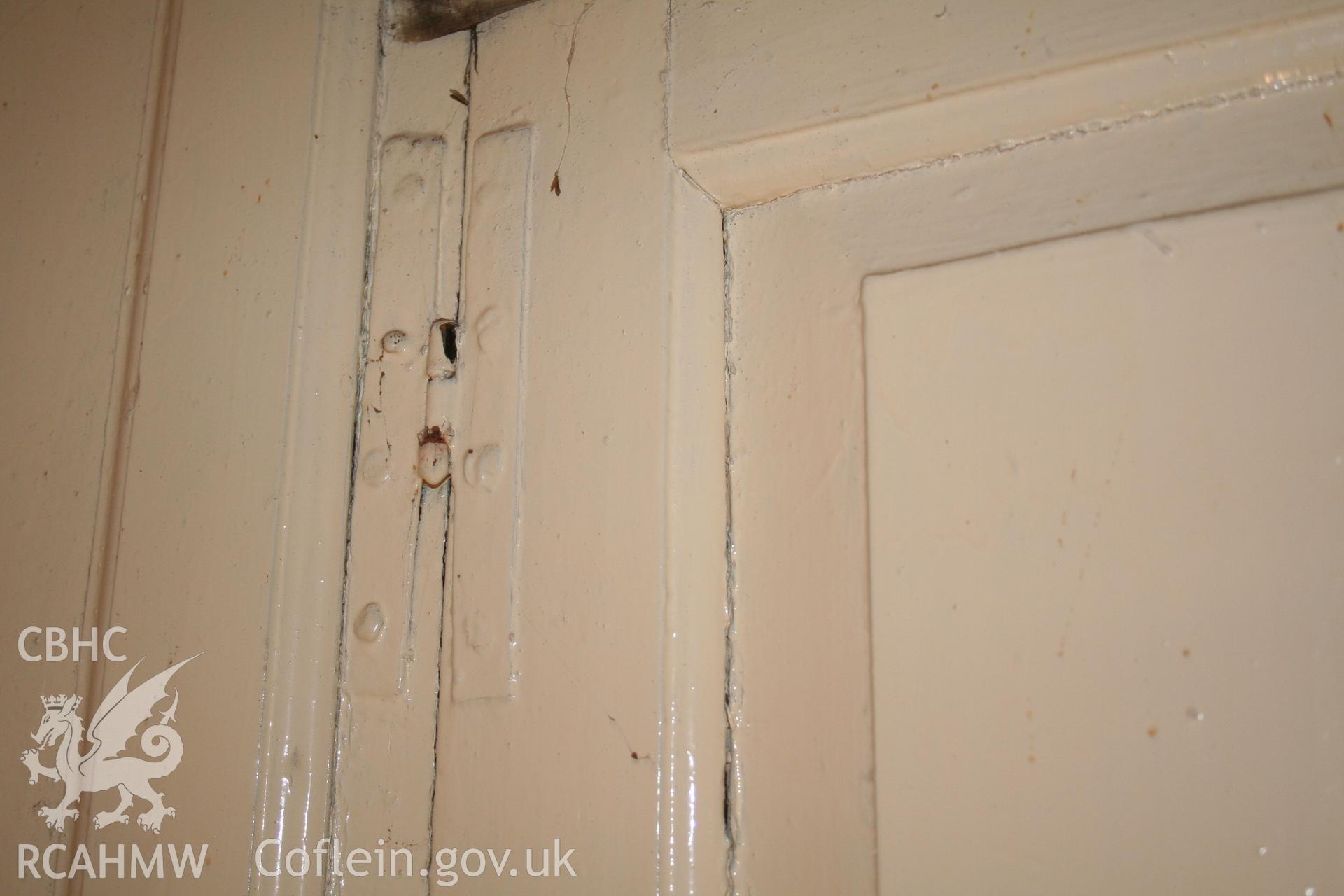 Interior second-floor cupboard against west front hinge detail
