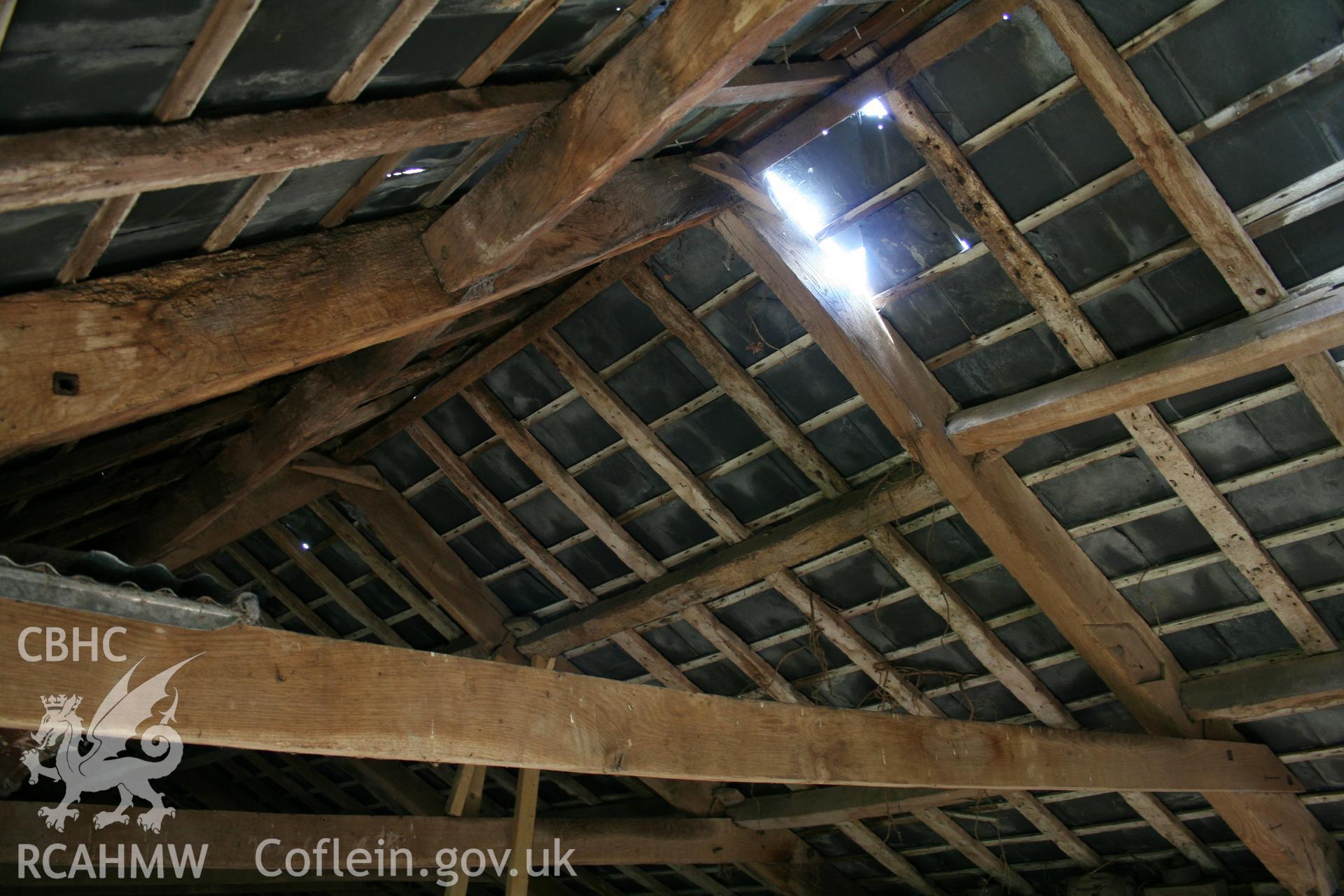 Interior of cow/house stable showing stable first-floor granary roof-truss.