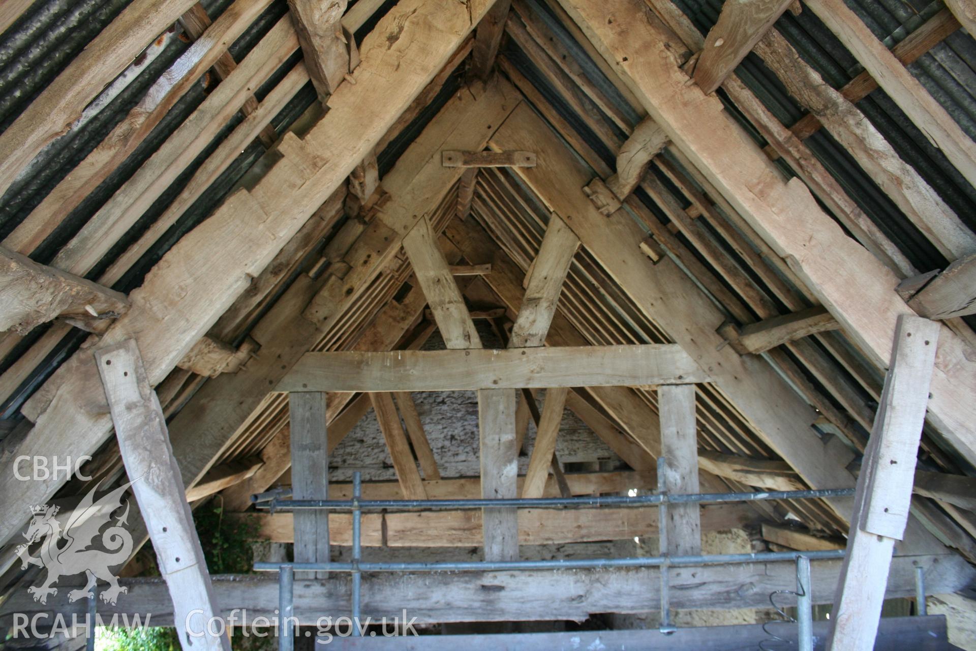 Interior of barn, showing later doorway to cowhouse projection to south.