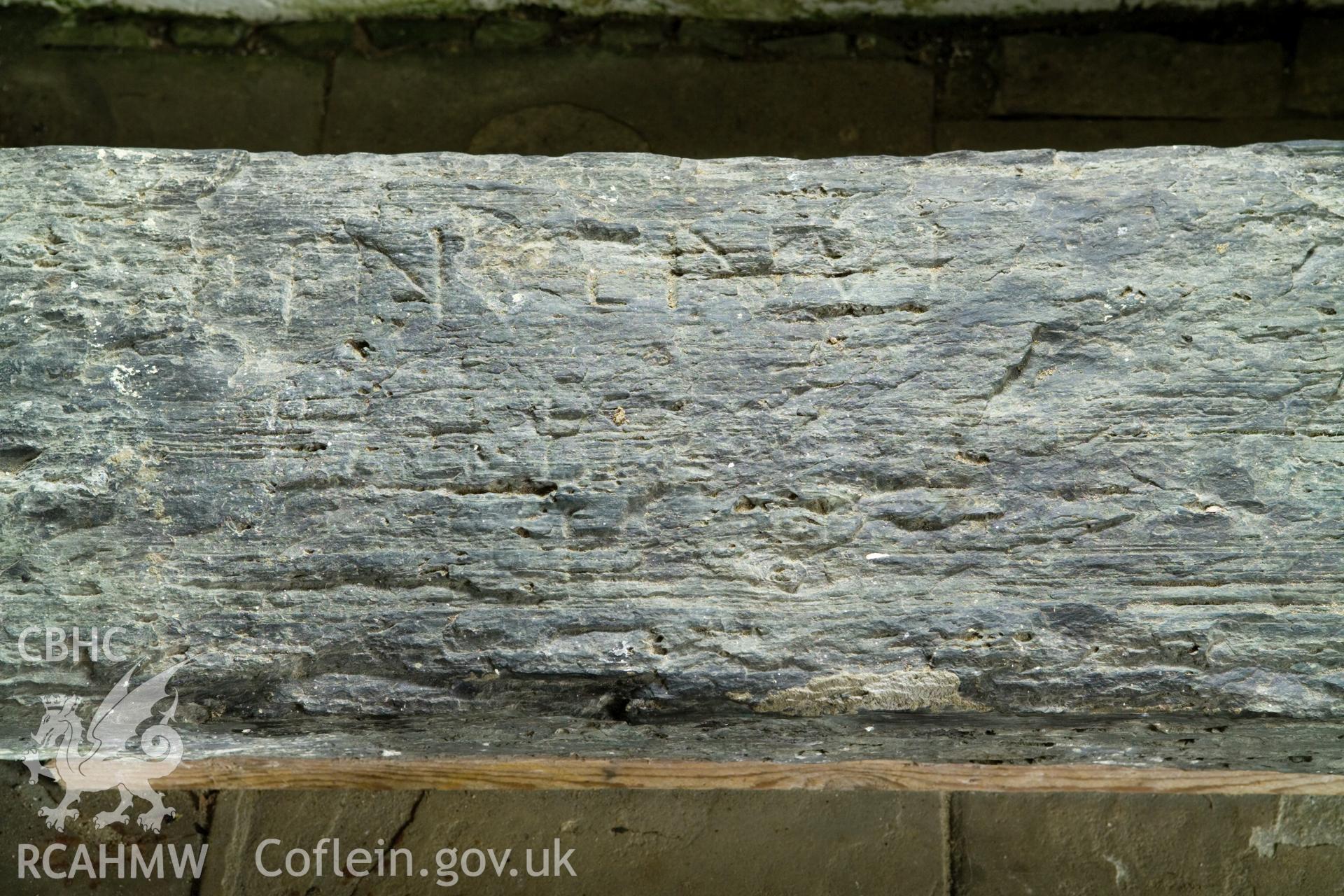 Inscribed stone against south wall, detail