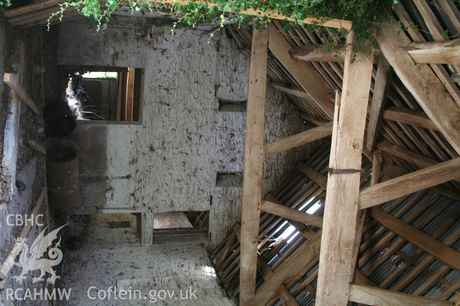 Interior of framed barn, showing  west end later stone wall.