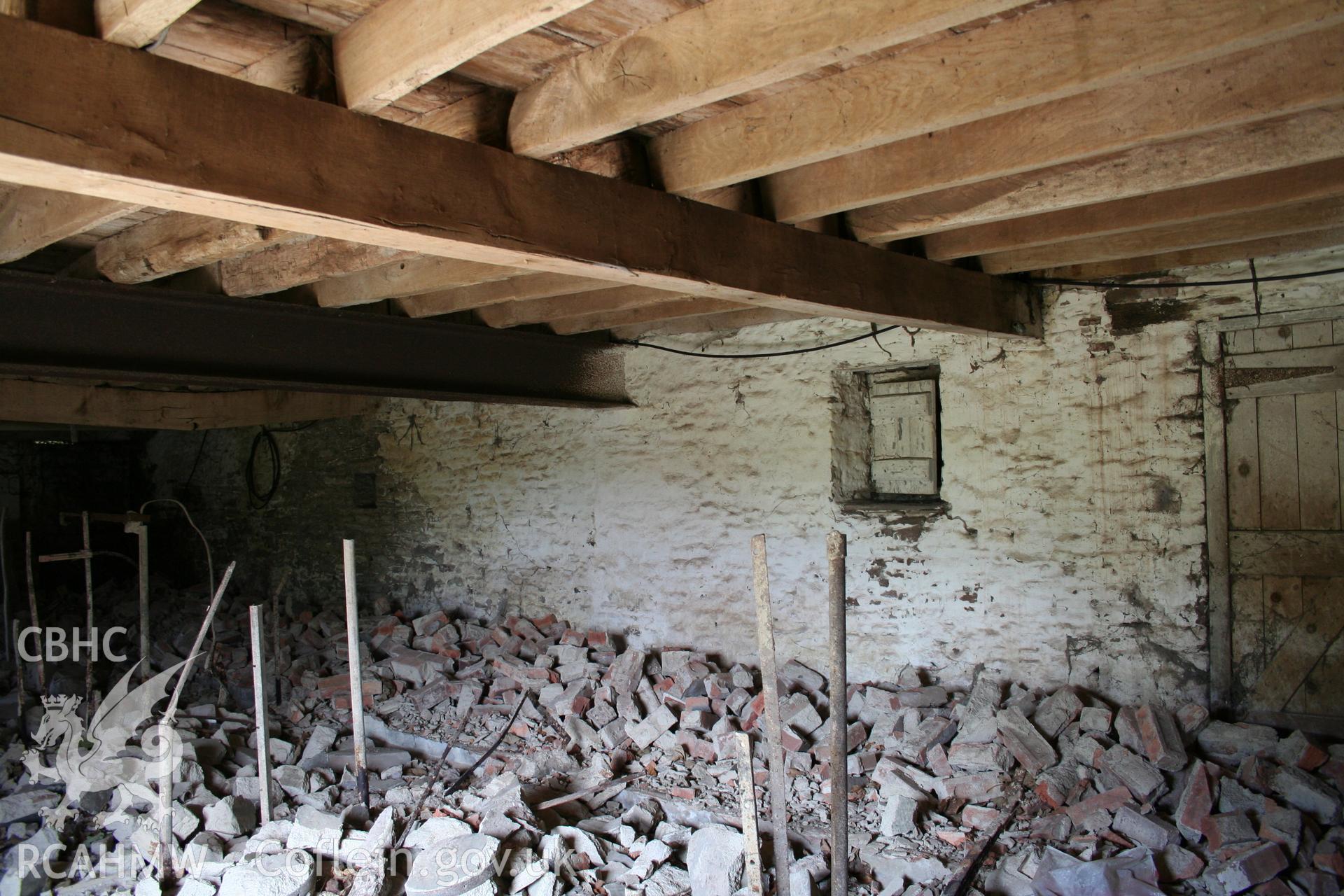 Interior of cow/house stable showing stable doorway to north-east.