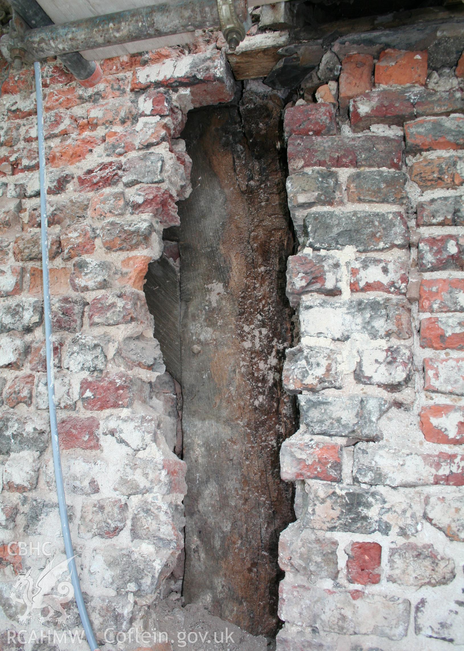 Exterior, of north gable-end showing principal-post buried in wall at west end