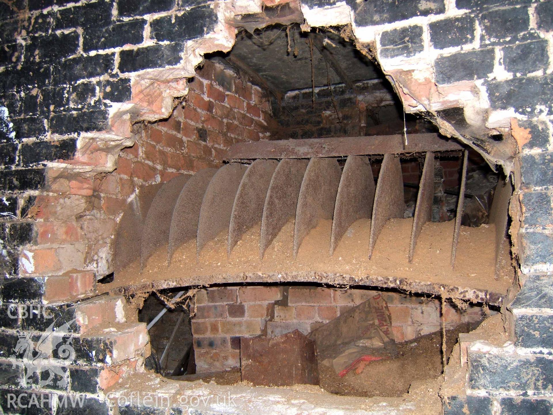 Stove basket in centre-west of basement of sheep-drying house looking south
