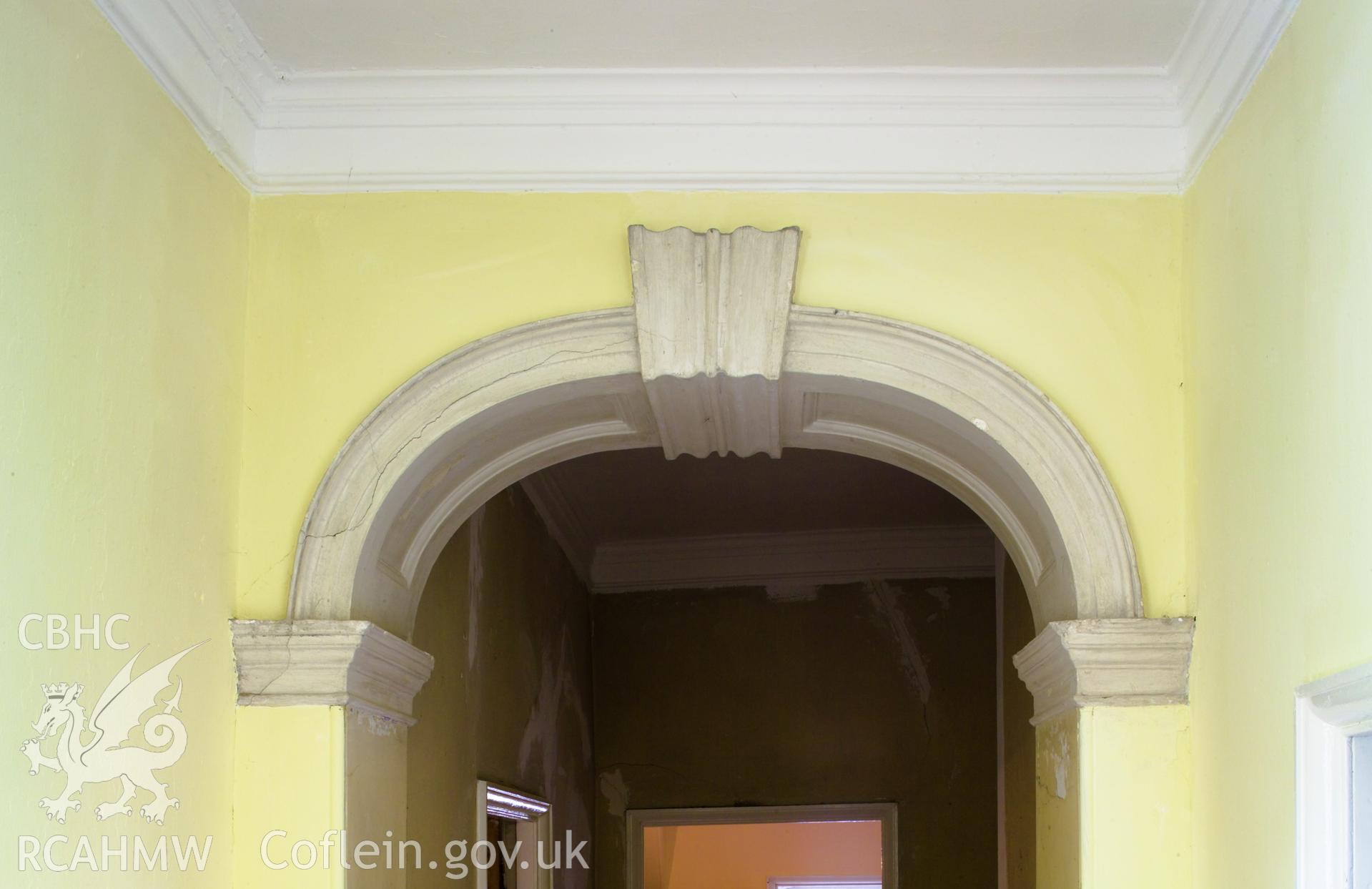 Plaster decoration over passage way openings.