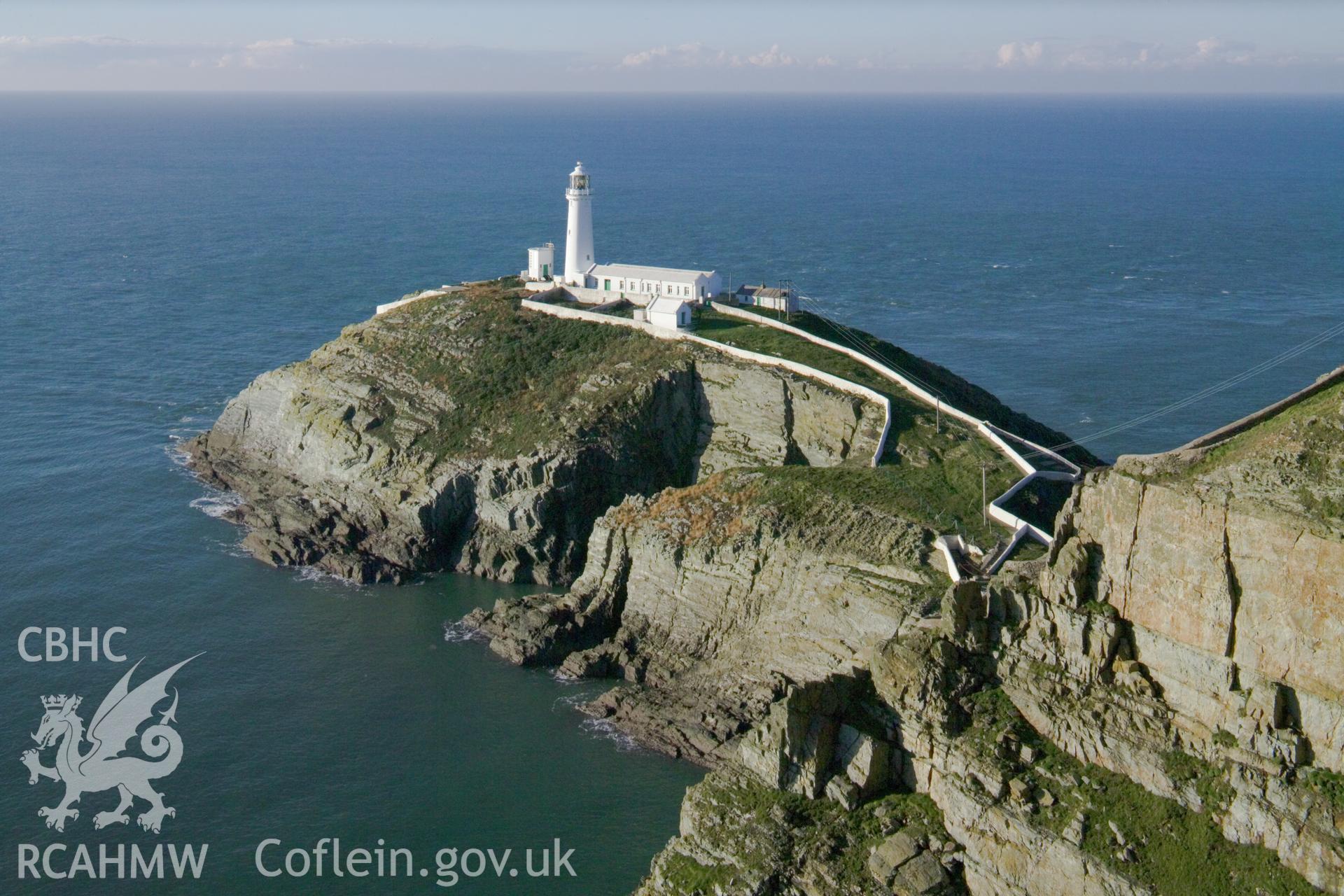 Distant view of lighthouse and headland.
