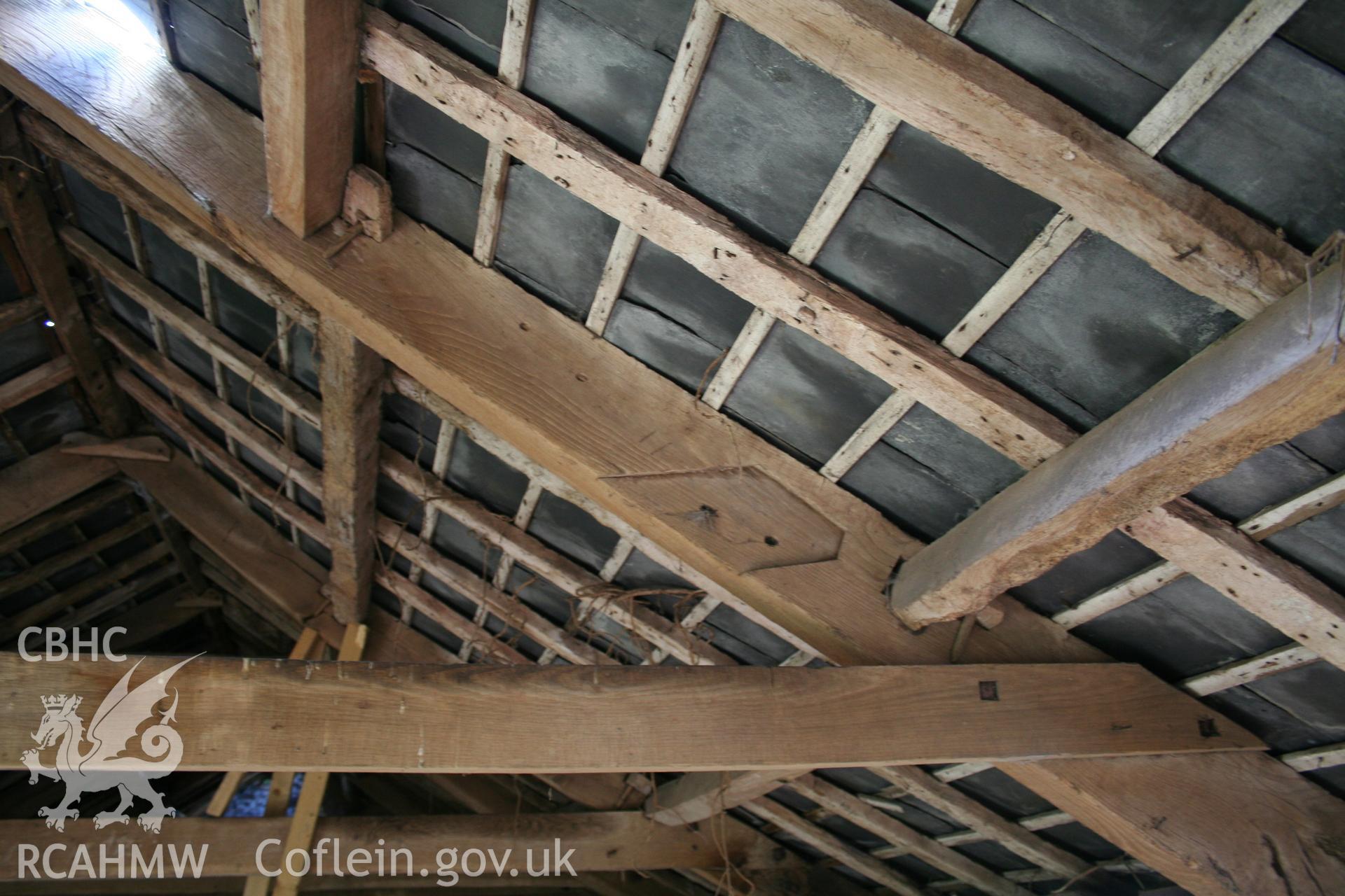 Interior of cow/house stable showing stable first-floor granary roof-truss detail at collar.