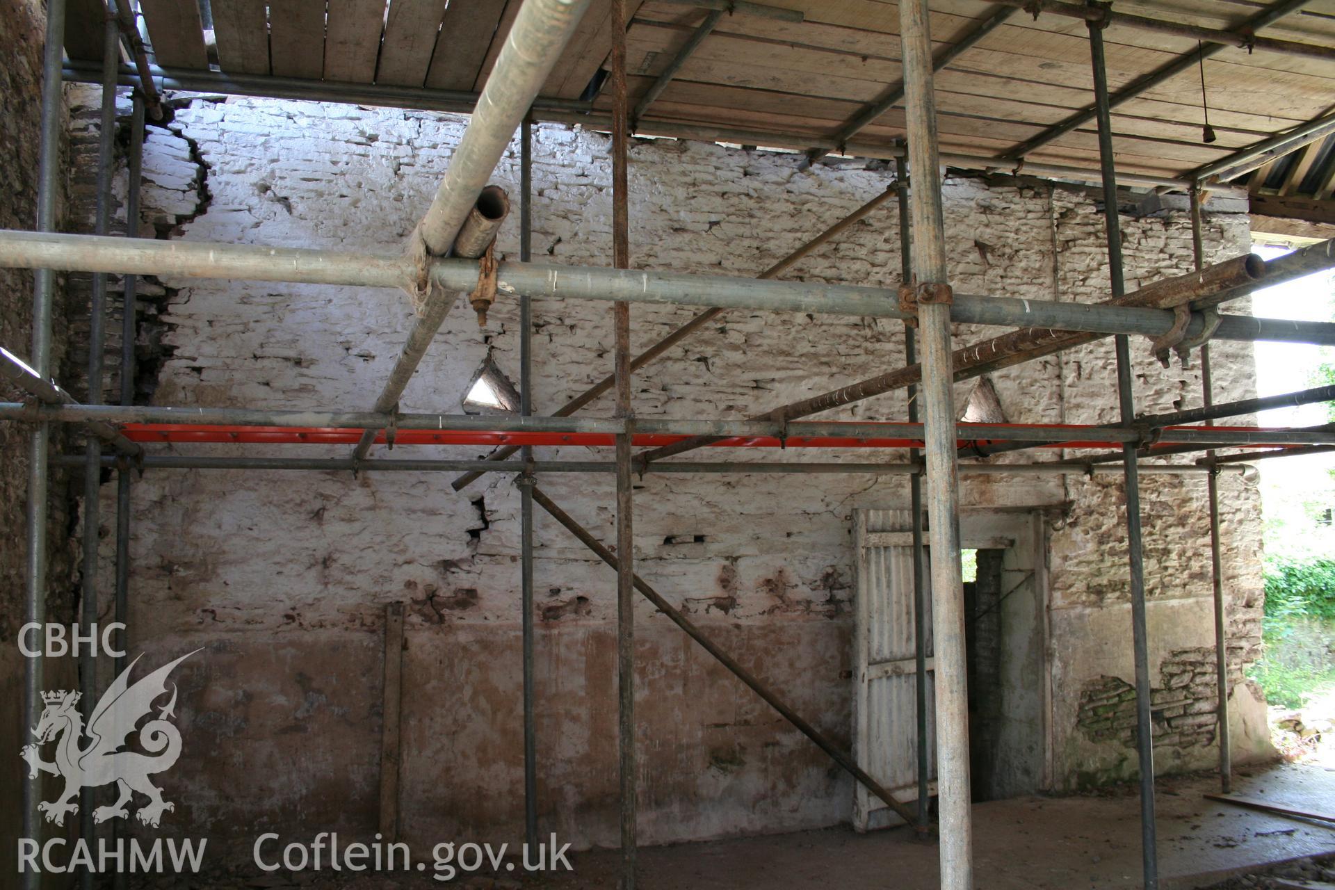 Interior of  barn, showing exterior east gable-end truss of framed barn.