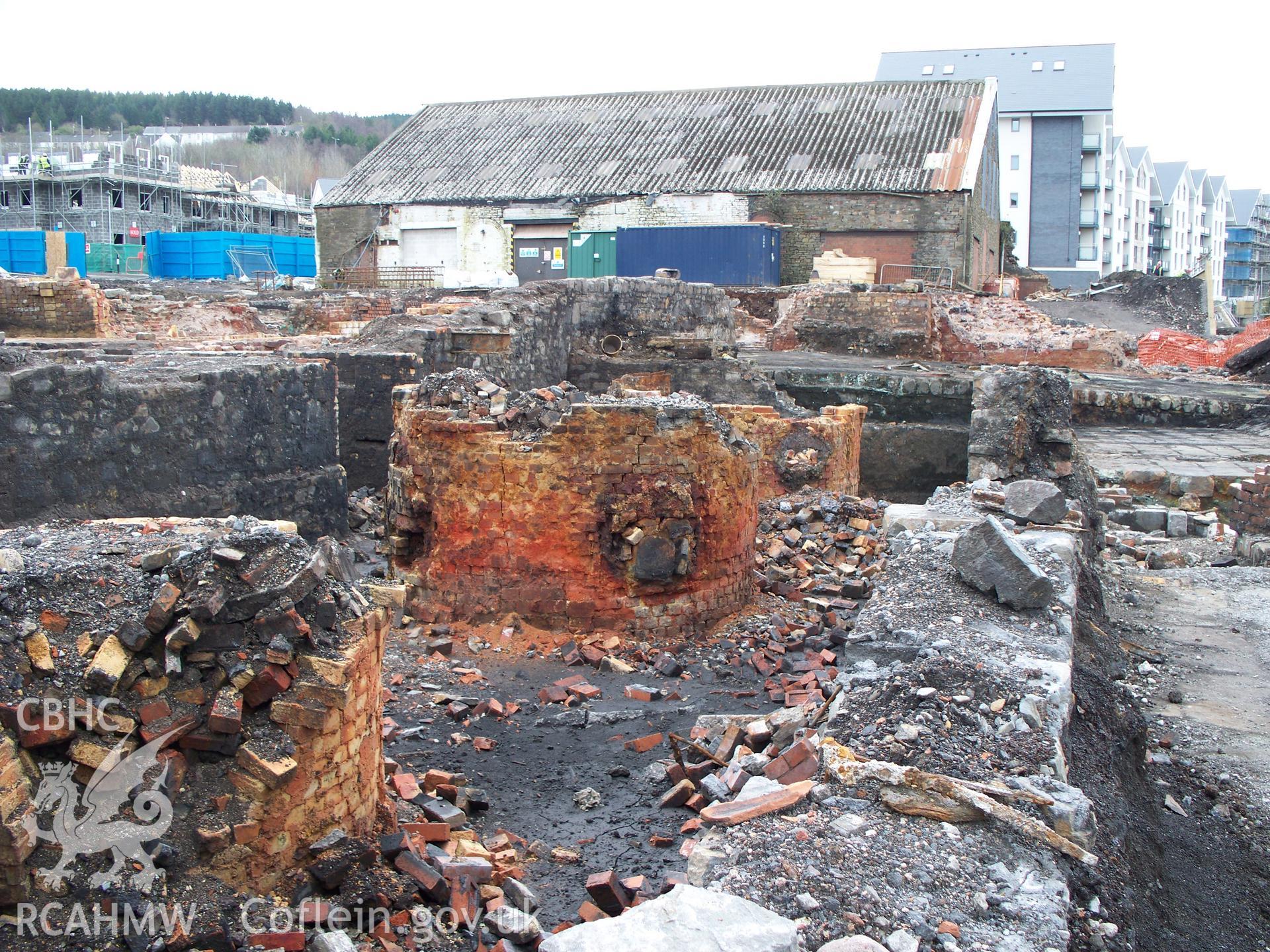 The three circular gas regenerative furnaces of the zinc works on its central west riverside with last works building at south & new flats.