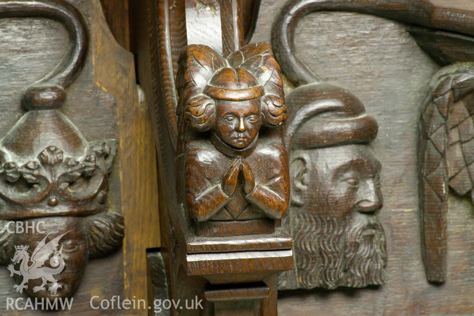 Misericord and dividing arm detail on south wall.