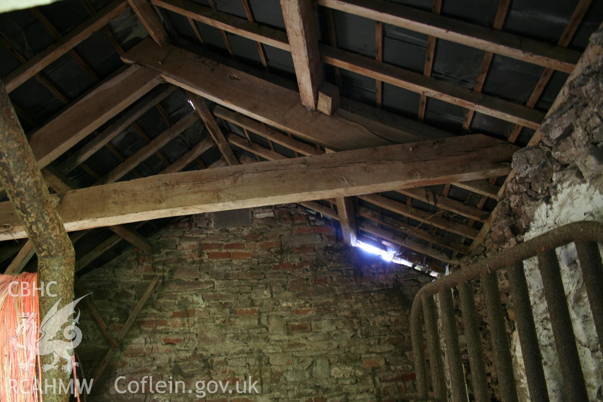 Interior  of cow-house at right angles to barn part open-fronted, at lower end.