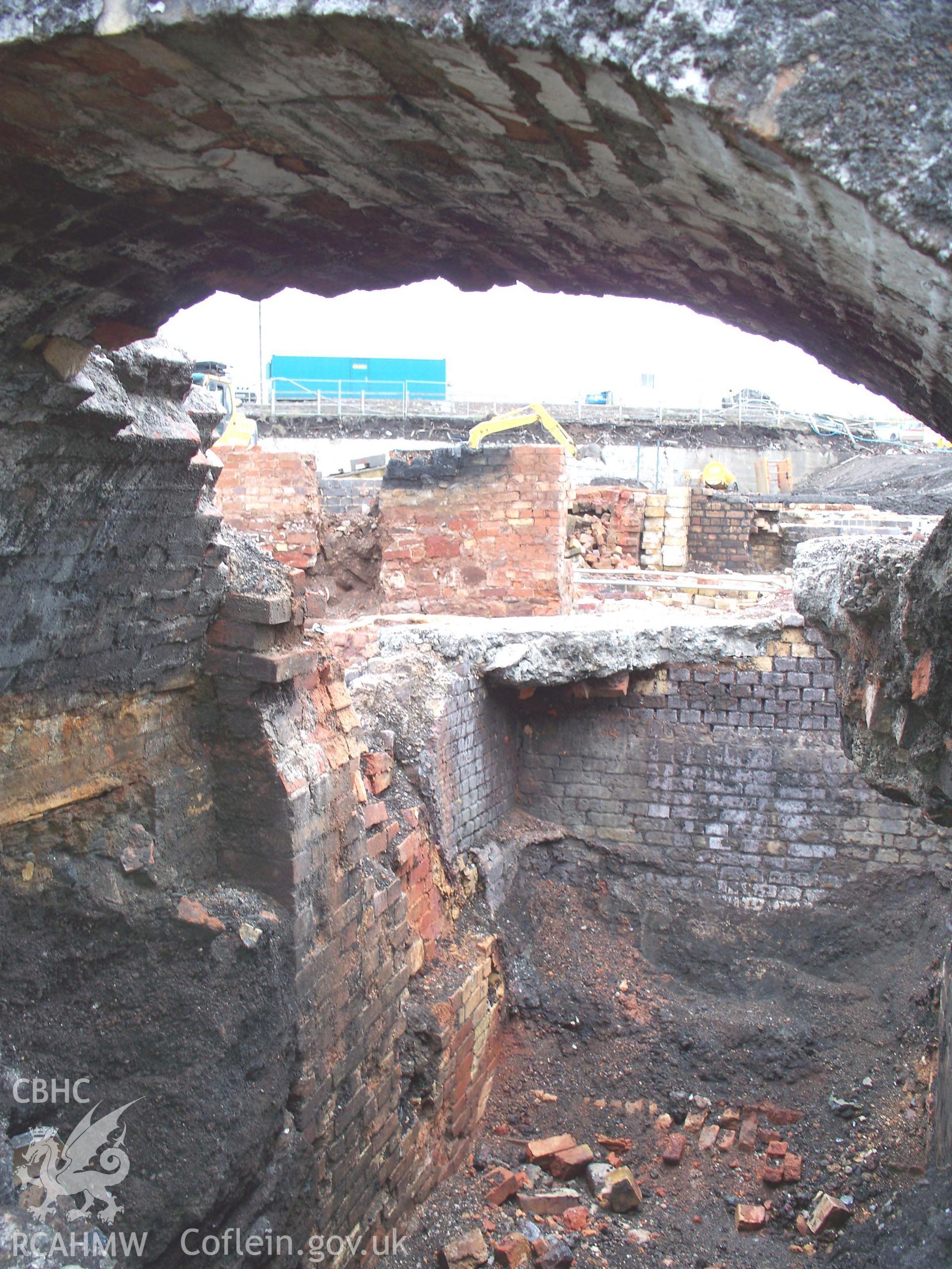 Looking east into the interior of a gas regerative furnace showing mark of a sloping iron-plate that retained the coke fuel.