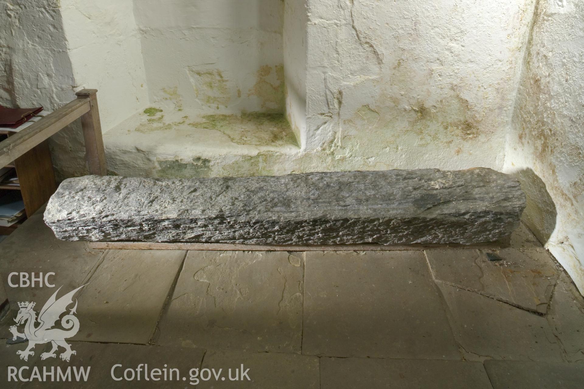 Inscribed stone against south wall