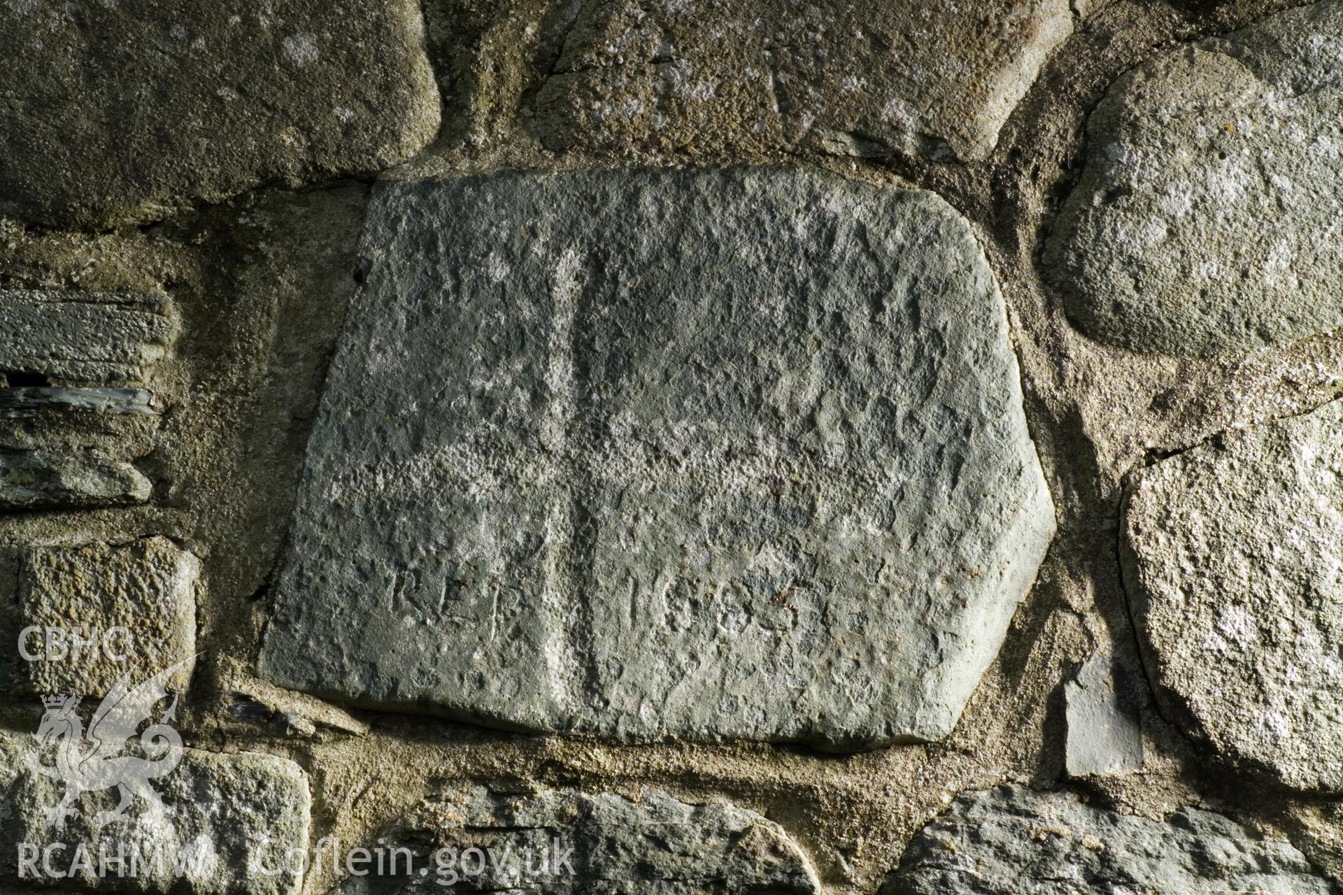 Insribed stone in exterior east wall