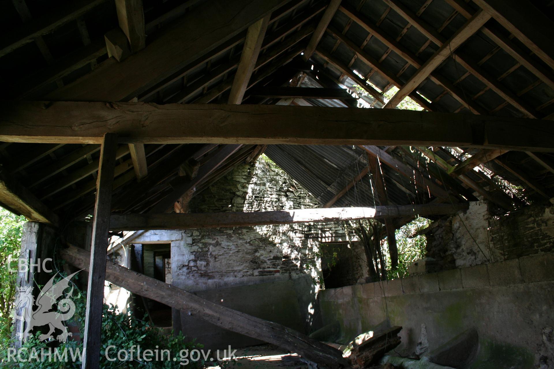 Interior  of cow-house at right angles to barn part open-fronted, at lower end.